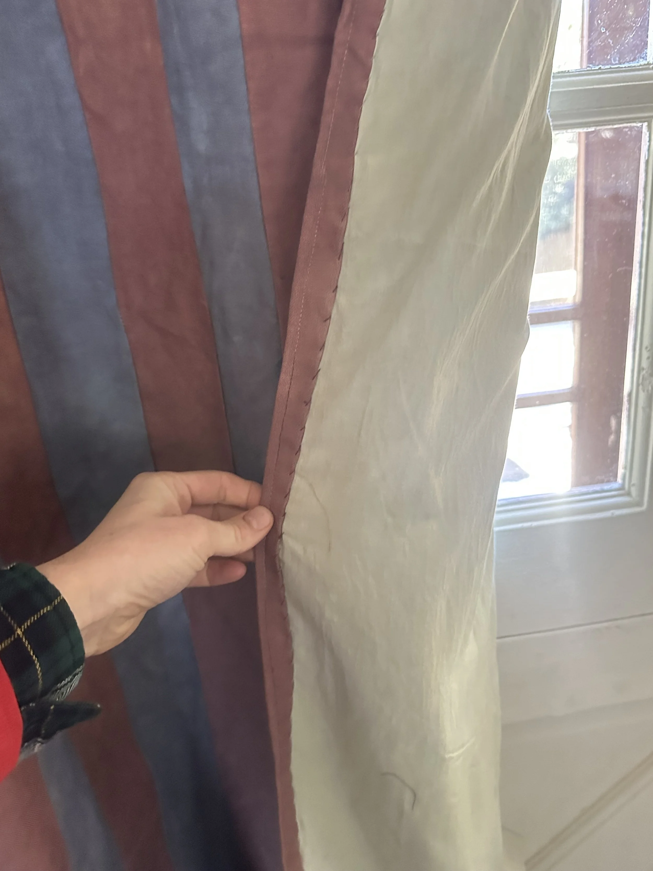 Detail of bespoke hand dyed linen door curtain