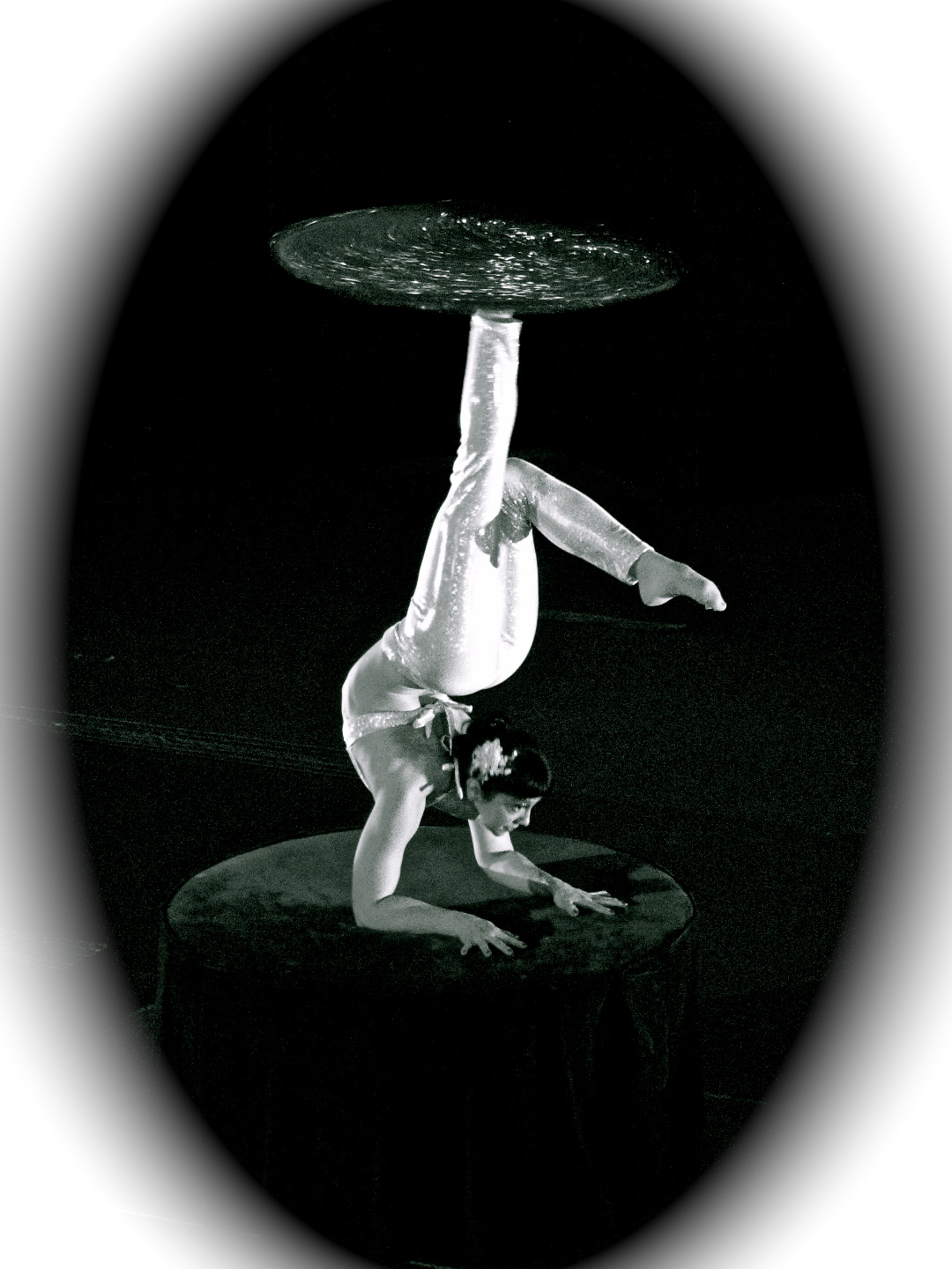 Contortion mixed with antipodism is an uncommon act with origins from China. Samantha Halas spins this carpet with h.er foot while simultaneously performing incredible feats of contortion.