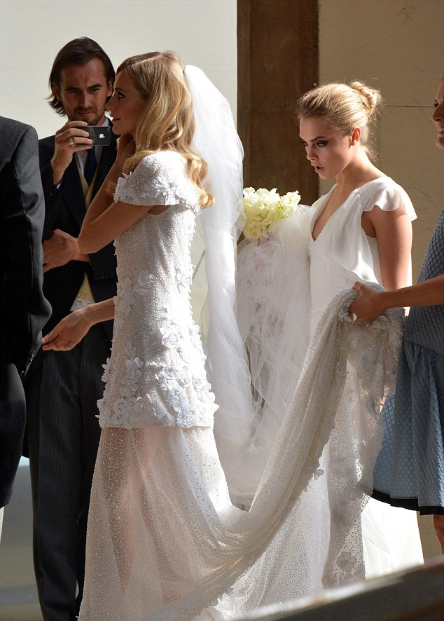 With intricate beading, a floral design, a sheer skirt, and a gorgeous train, this Chanel is to die for.