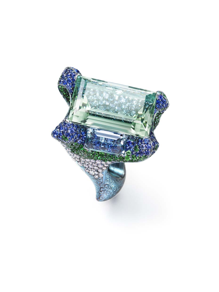 Wallace Chan Cloudless Climes ring set with a central 31.13ct aquamarine and two additional aquamarines, diamonds, tsavorites, garnets and sapphires.