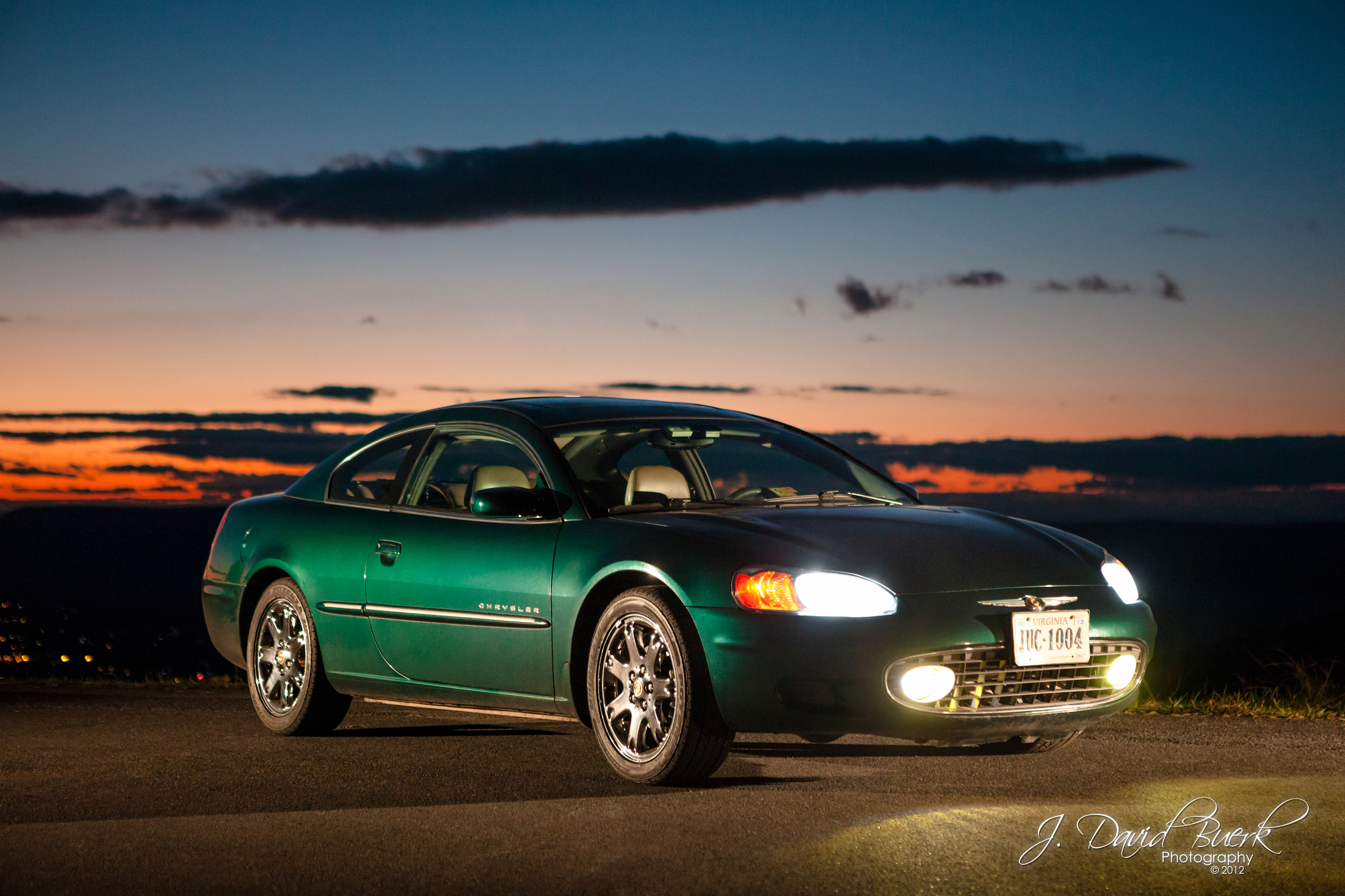 It's green! And it's the only decent photo of my car!
Strobist:
Bare Speedlite 600EX-RT with CTO camera left triggered via PocketWizard Flex.
Bare Speedlite 600EX-RT with CTO camera right aimed at front bumper triggered via PocketWizard Flex.