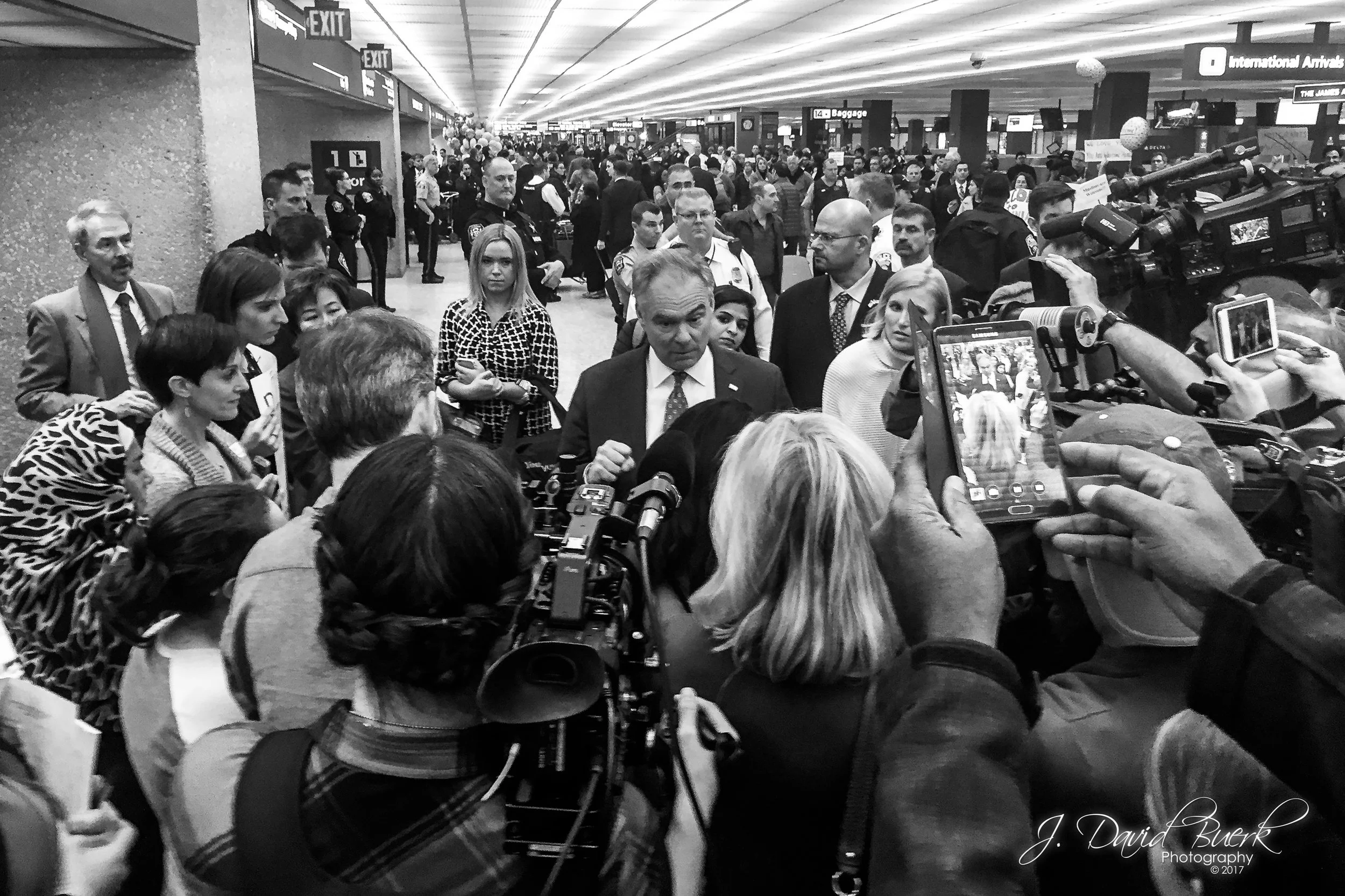 Virginia Senator Tim Kaine (D) arrives at Washington Dulles International Airport and speaks with legal counsels volunteering on-site.