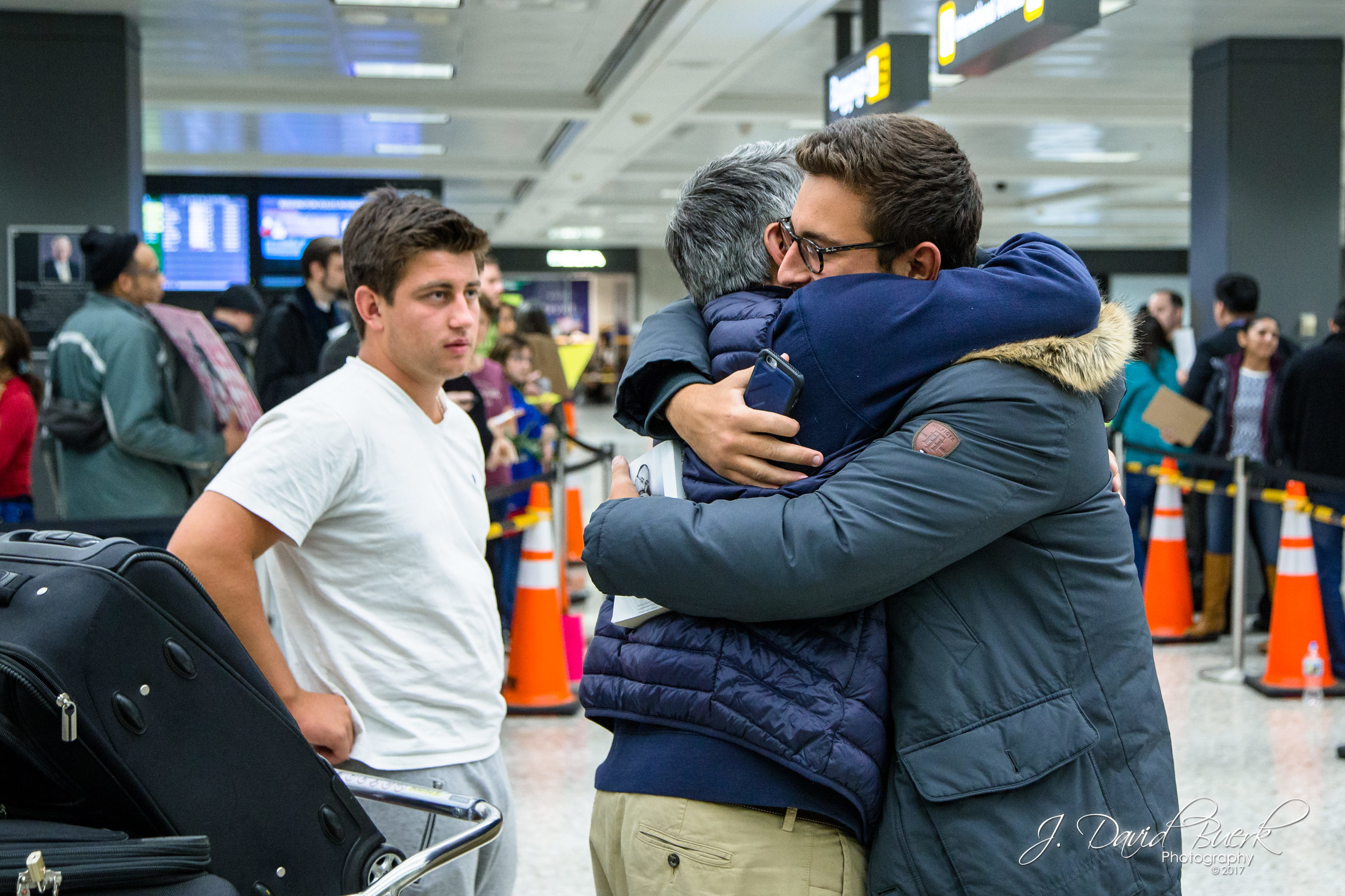 Reunions upon clearing customs are often emotional regardless of residency, citizenship, and immigration status.