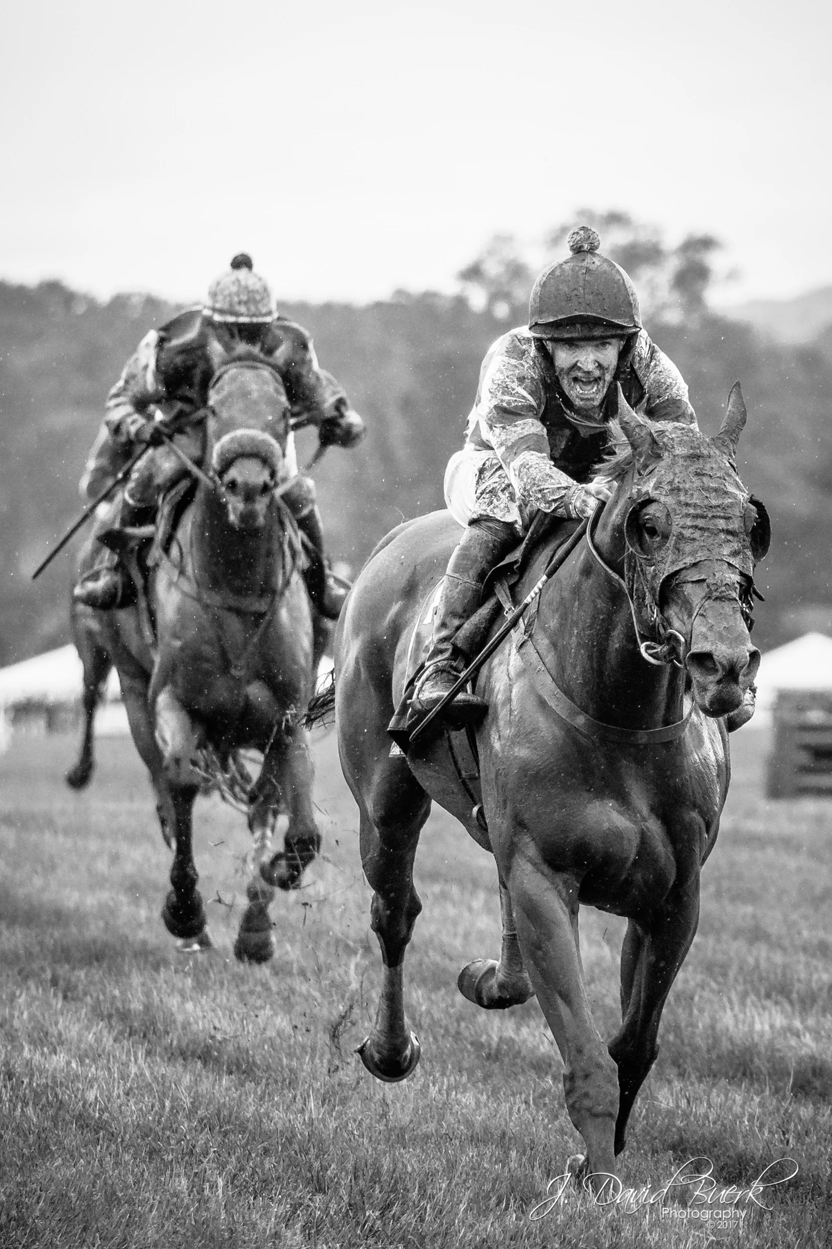Jockies on the main straightaway approach the finish line at the Virginia Gold Cup. &nbsp;2017 hosted one of the rainiest, muddiest Gold Cups of recent history.