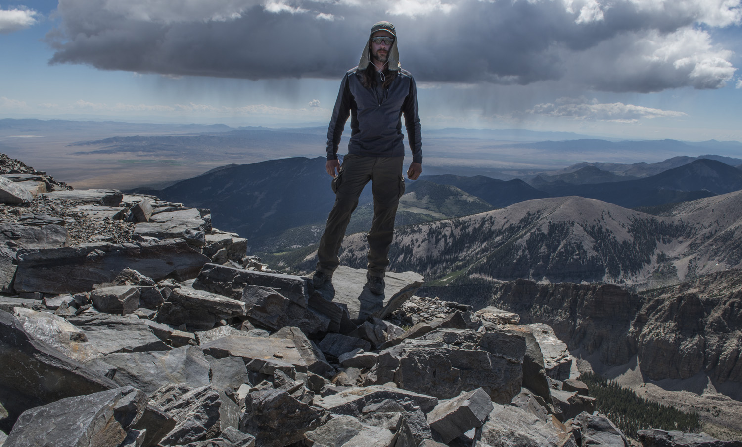 On the summit of Wheeler Peak. Notice the rain in the background.