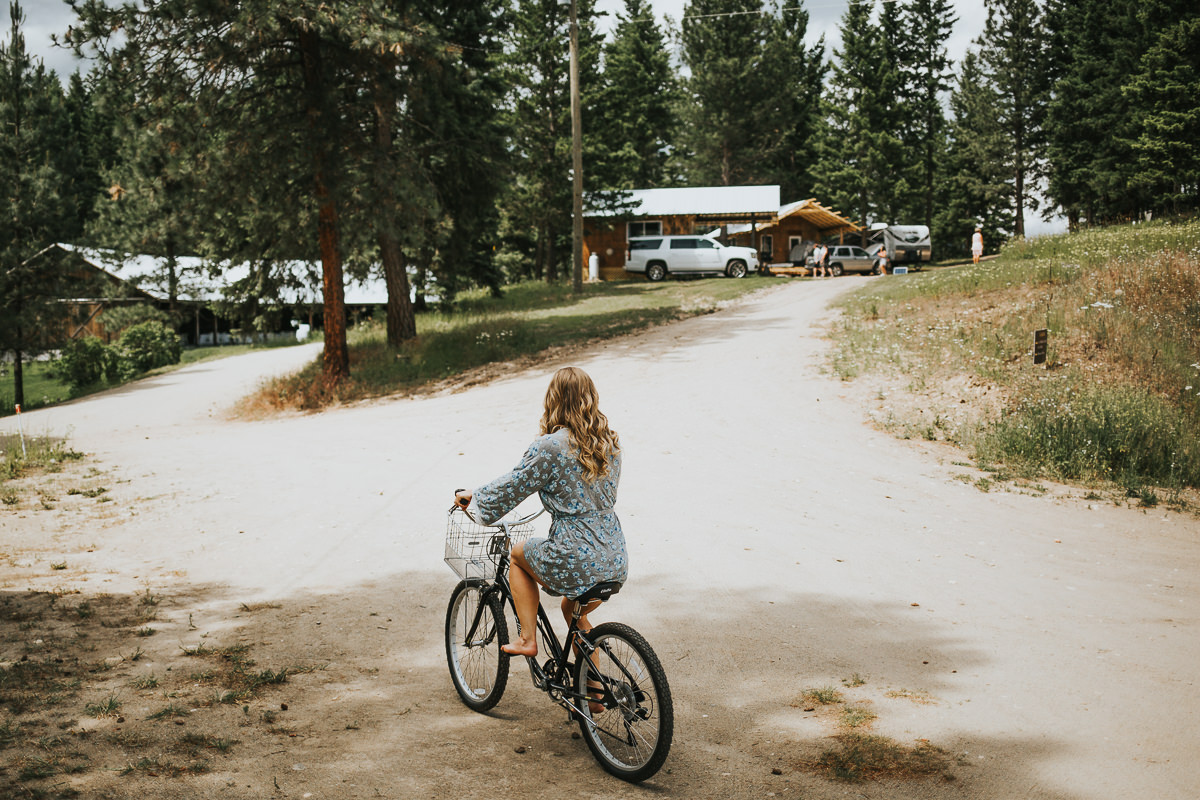 Bridesmaid flower robe riding bike before wedding