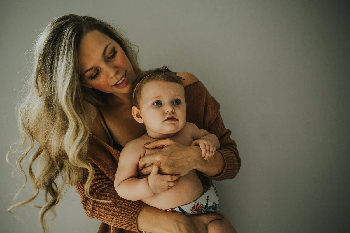 Mother and daughter cozy at home family photo session