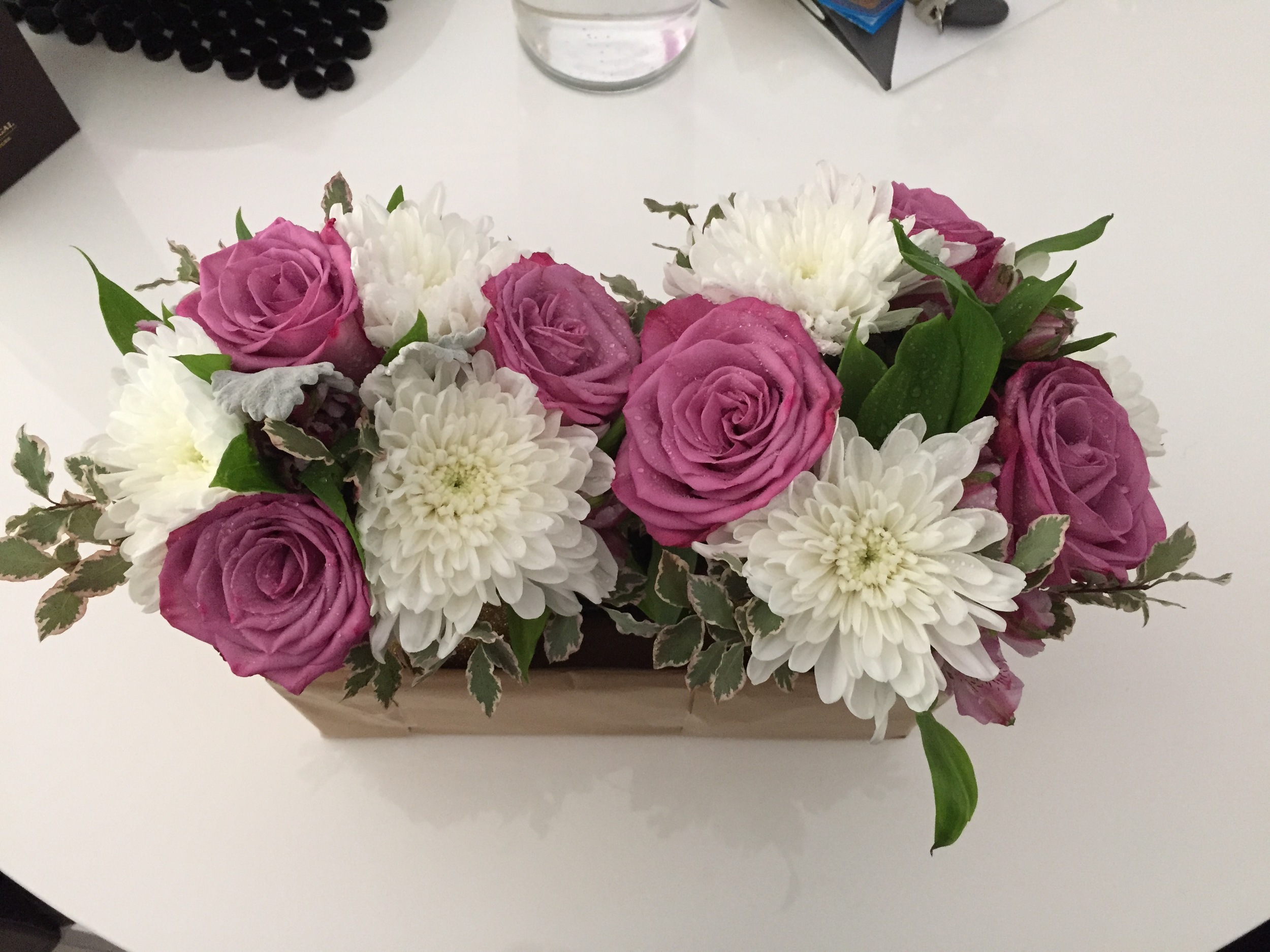 I had a local florist make up these bunches and gave them the vases to work with.