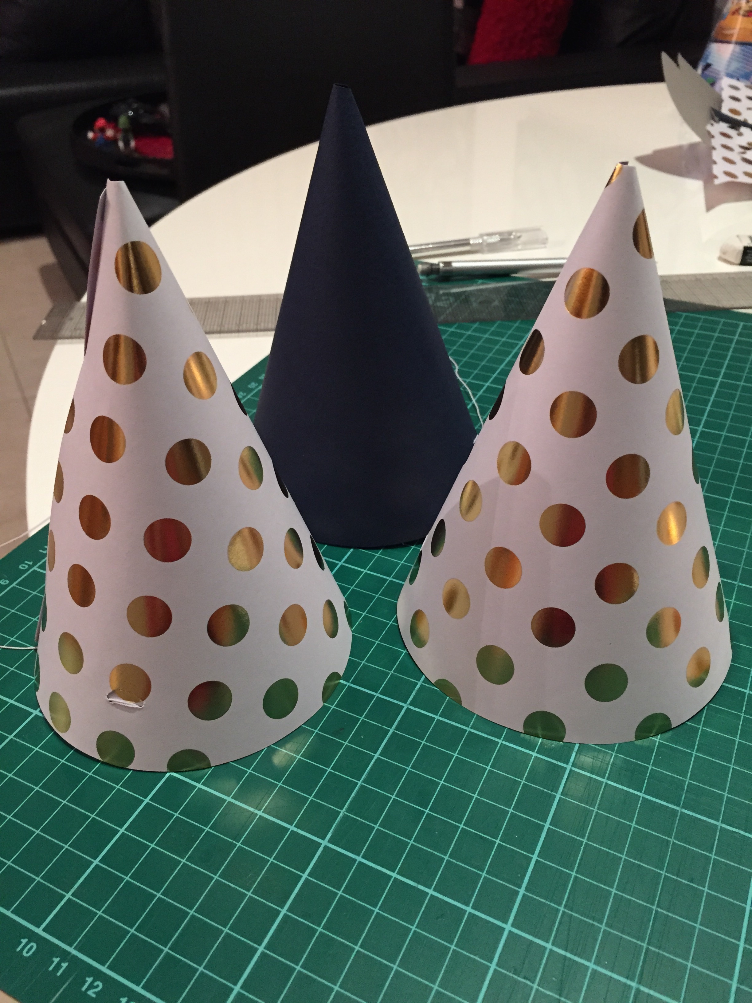 And now you are done!! Also in this picture you can see more clearly how the string and flap sits on the outside of the hats. I made the blue one for Matt as there is no way he would wear the polka dot versions LOL.