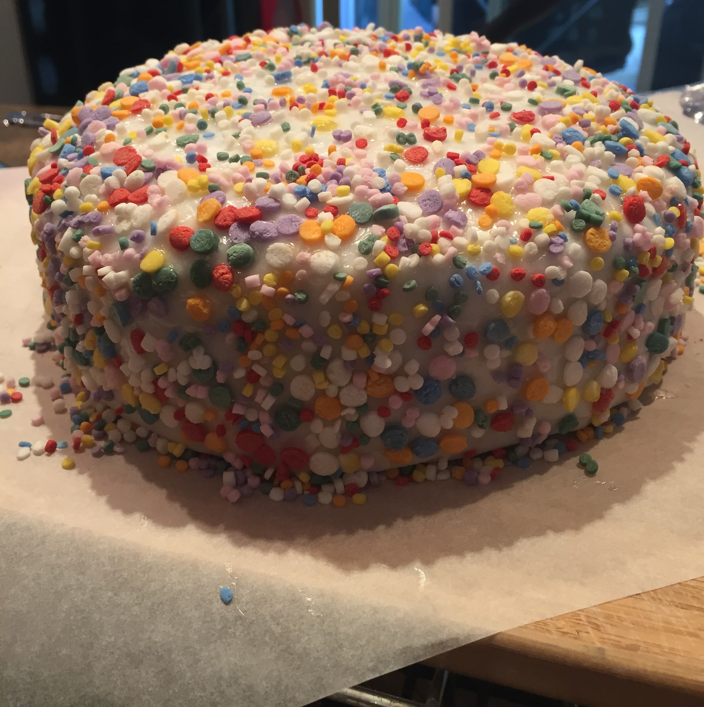 As I mentioned above I left this tier until last, in case i ran out of sprinkles, and as you can see I did. The store didn't have much stock in when I bought them so I got the really small sprinkles as a back up. You can see here how the piping gel is also visible through the white gaps, which is fine when you paint it.