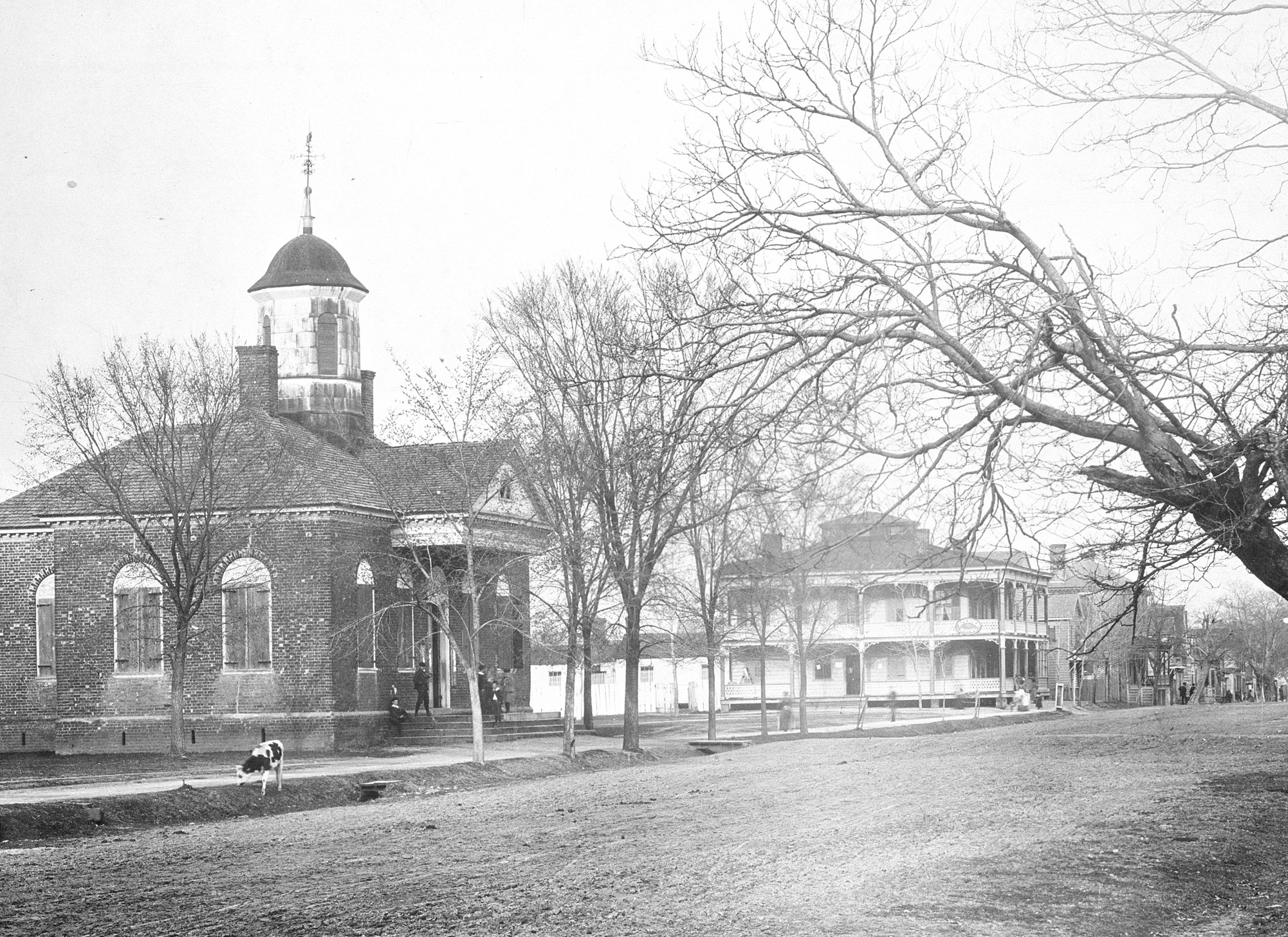 View looking east on Main Street of the 1770 Courthouse and Spencer Hotel (Mr. Harrell's Lodging House in 1860), ca. 1890s 
