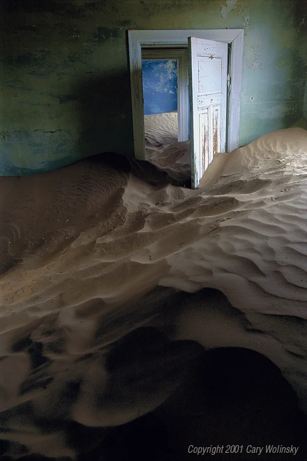  Sand House Series, Sand House Blue (vertical). Kolmanskop, near Luderitz, Namibia, 2001:  I stumbled upon Kolmanskop, an abandoned mining town near Luderitz while working on a story about diamonds for the National Geographic Magazine. In 1908, Nam