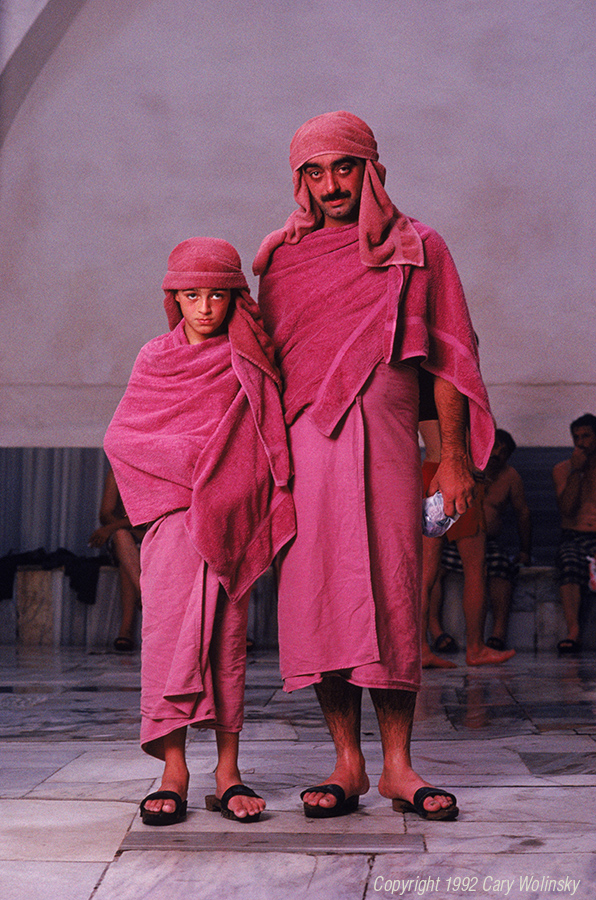 Father and son draped in cotton towels at a bath in Bursa, Turkey. 