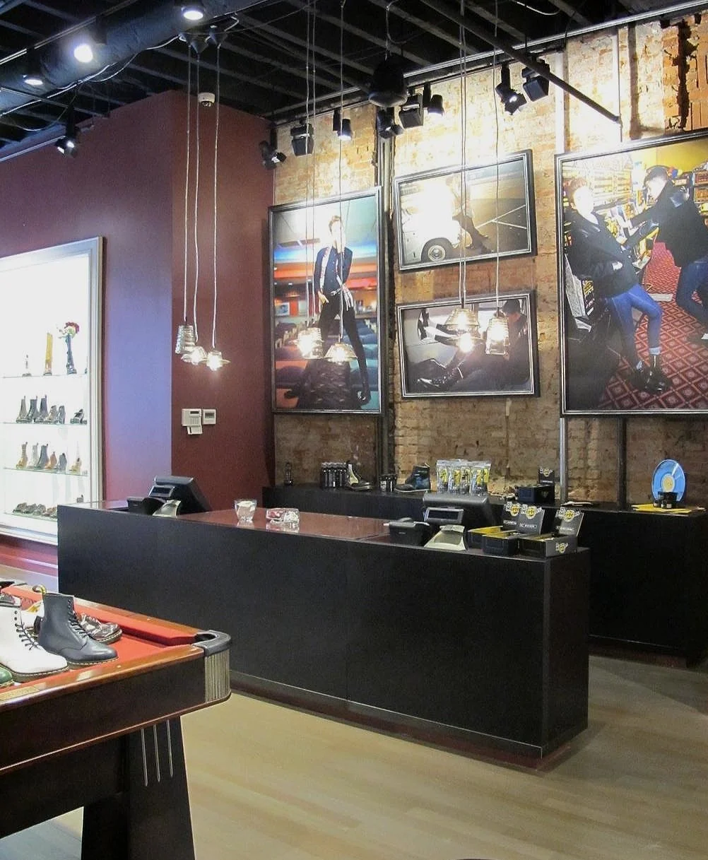  Blackened-birch, metal, and glass cash-wrap area, plus matching metal art frames, built and welded for the Philadelphia location of  Dr. Martens  boutique 