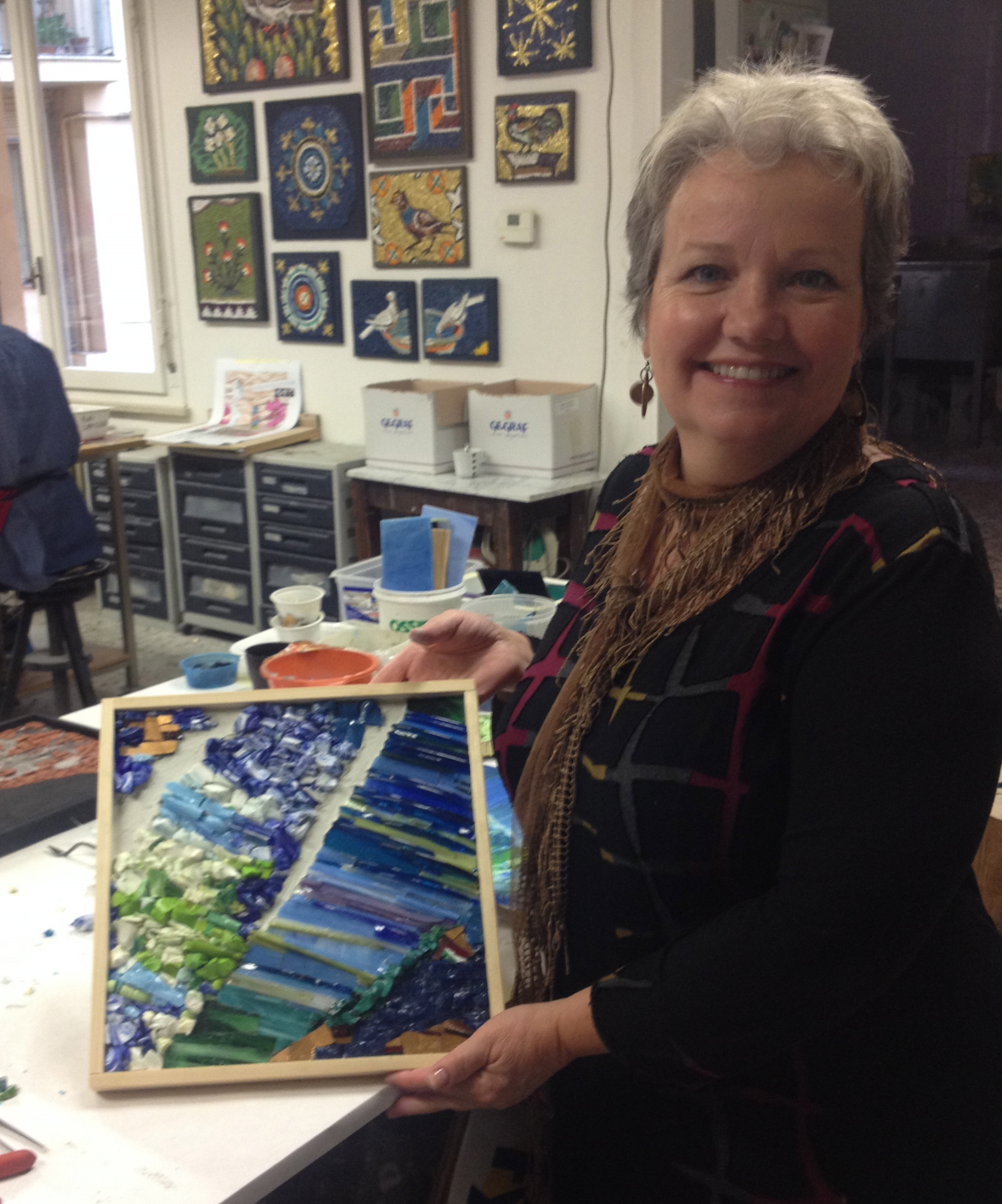 Margy, on her second Mosaic Masterpieces Tour, with a piece she made during an exclusive tour workshop at Kokomosaico. She used her own painting for inspiration.