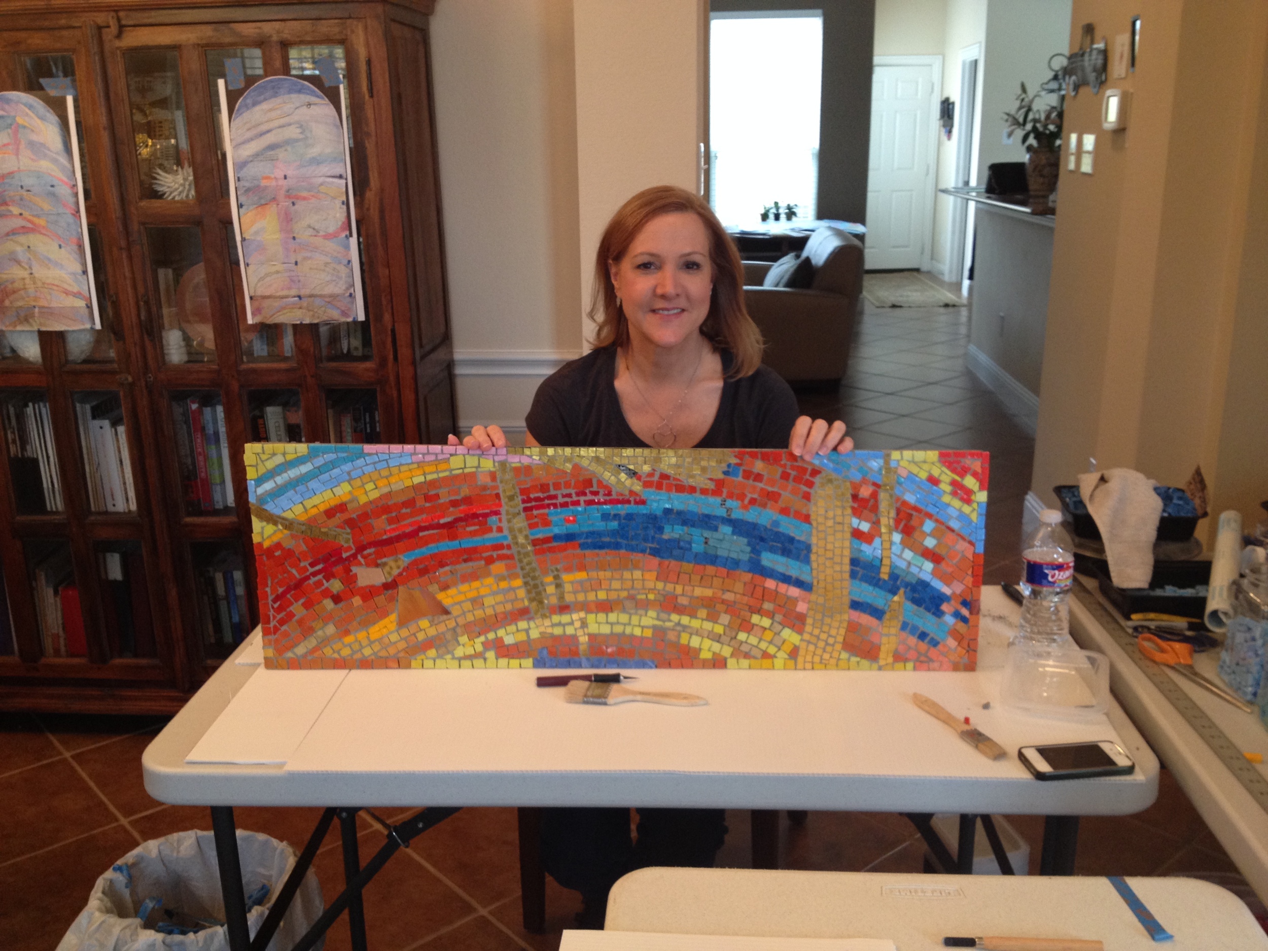 Lynne Chinn shows off a thinset panel from one of the font stairs.