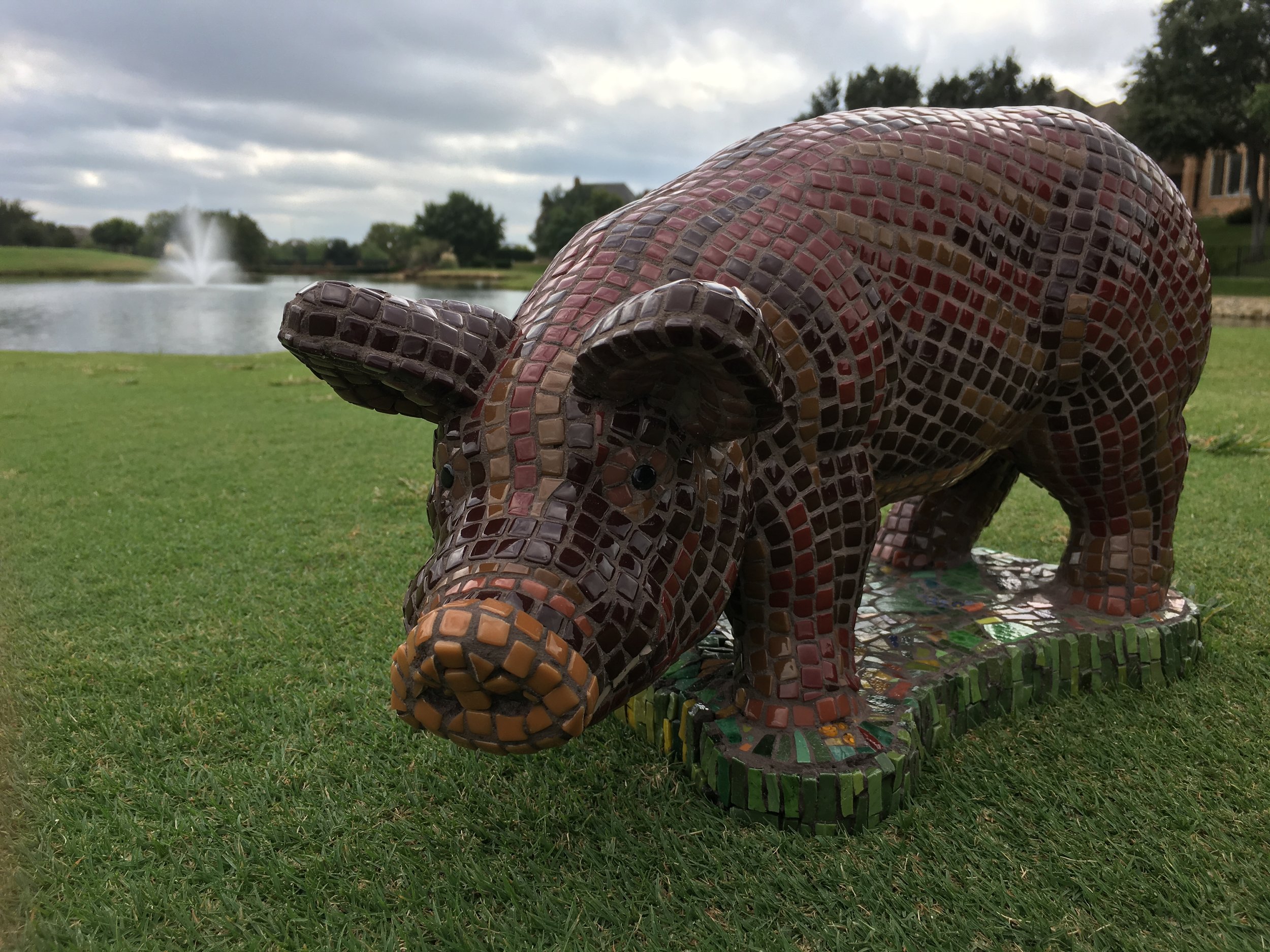 Caramel the Truffle Pig is made of enameled glass, smalti and millefiori on a concrete base. Suitable for outdoors. 18 x 10 x 9 inches. 37.5 lbs. $1800.