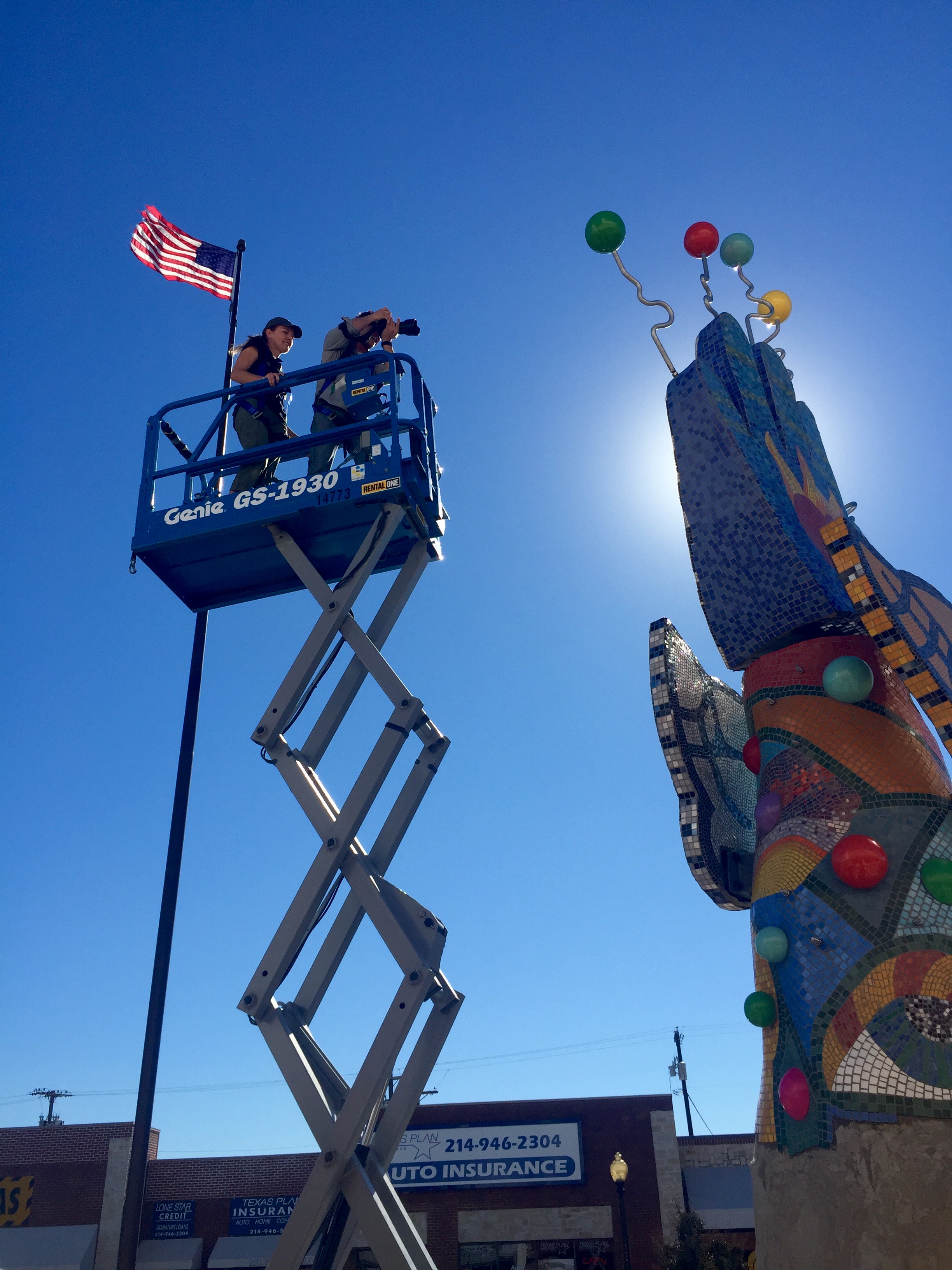 Our student intern Hope Treviño took this photo of Advocate Magazine photographer Danny Fulgencio getting the bird's eye view of Piece 24 and the Texas Theater.