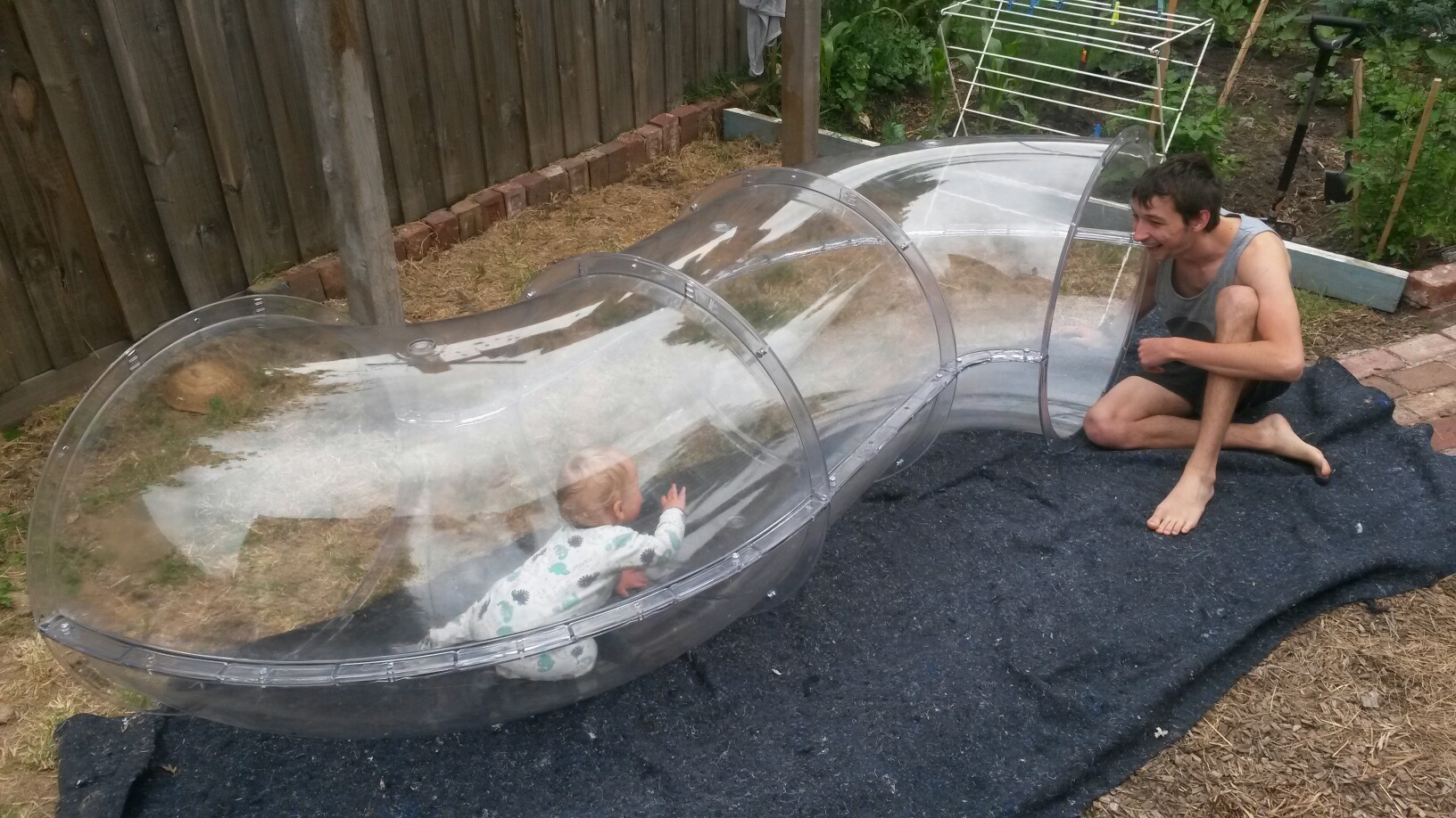 This is my son, December Jack in the tube and my nephew Zac testing the durability of the sculpture!