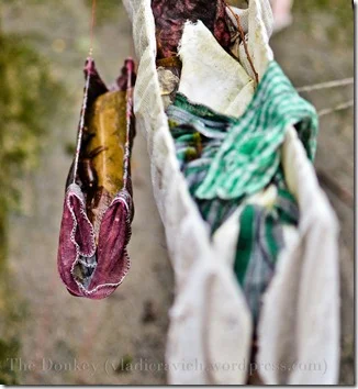The different items left by the faithful each have their own meaning, these bundles for example, are symbolic of cribs and are left when the visitor asks for fertility.
