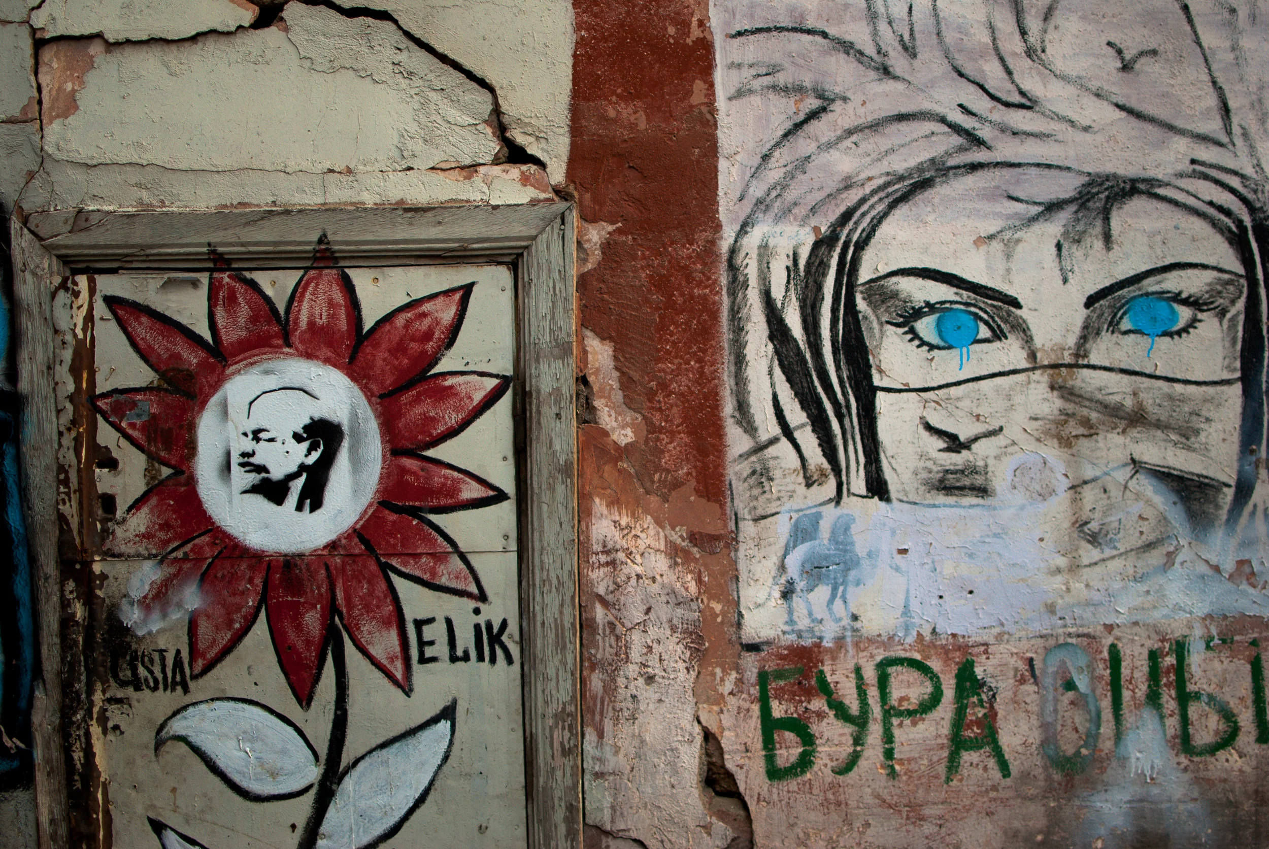 The graffitied wall of a school in Baku showing the hodgepodge of lingual and cultural influences in Azerbaijan.