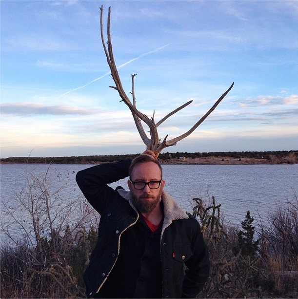 Eric at the lake, with antlers