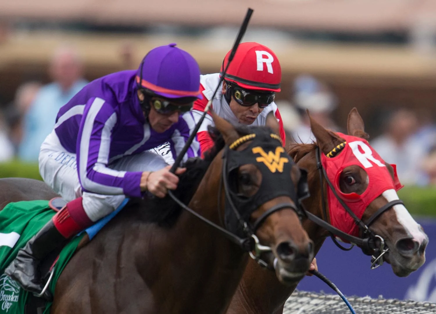 Heading to the finish line Mike Smith, right, pushes Luck of the Kitten against Hootenanny with Lanfranco Doyle during the Breeders' Cup Juvenile Turf 6th race of the Breeders Cup World Championships at Santa Anita Park in Arcadia on Friday. Hootenanny with Lanfranco Doyle wins the race.