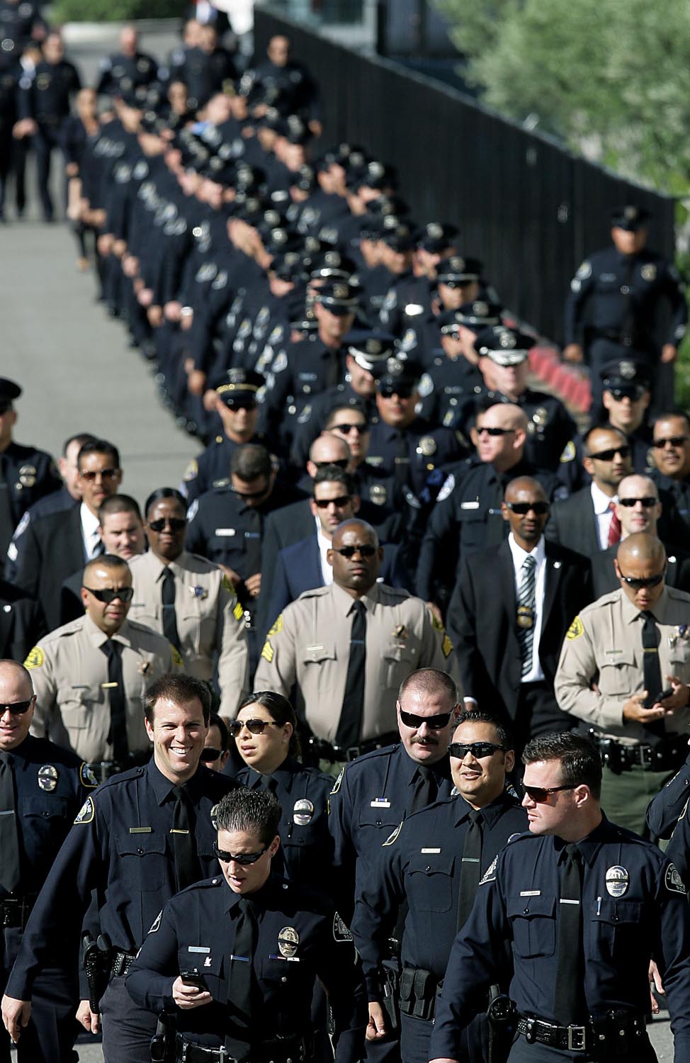  Thousands of emergency personnel arrive for services for Pomona police officer Shaun Diamond at Citizens Business Bank Arena Thursday in Ontario, CA. November 6, 2014.
Diamond who was shot and killed in the line of duty last week. 