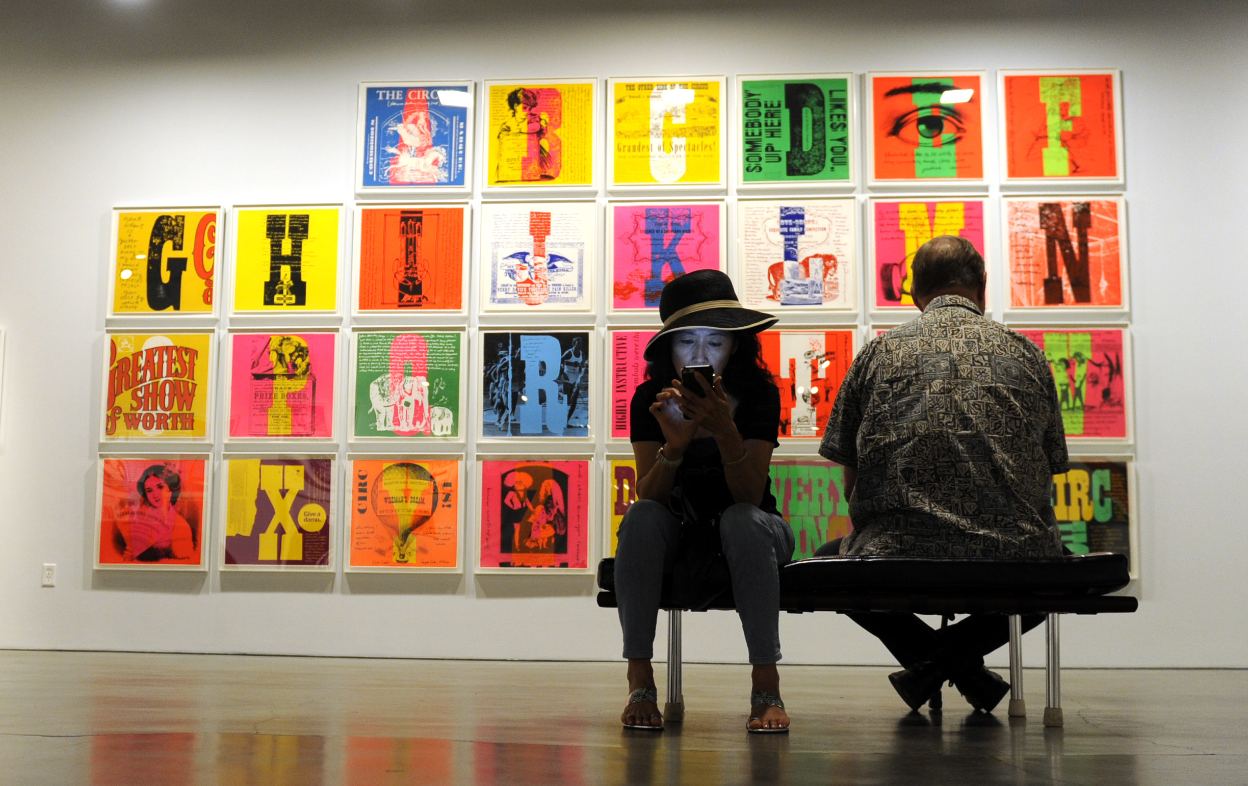  Glory Huang, left, looks at her phone during a docent tour of "Someday is Now: The Art of Corita Kent" at the Pasadena Museum of California Art on Saturday, July 11, 2015 in Pasadena, Calif. 


  