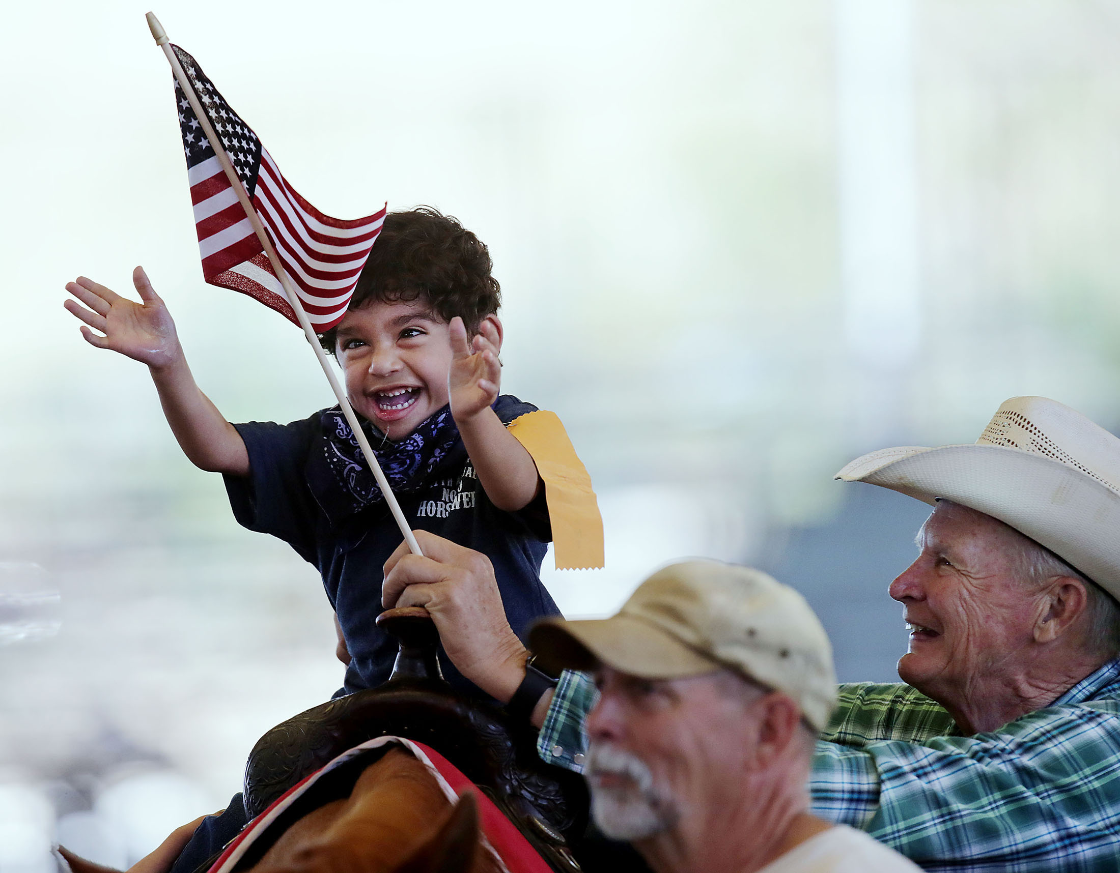  Giovanny Lizardi, 5, of San Bernardino enjoys a ride on a real horse as he reaches for a flag as he enjoys Challenged Children's Rodeo for special needs kids at Ingalls Park in Norco, CA. Sunday, Apr. 23, 2017. 
 