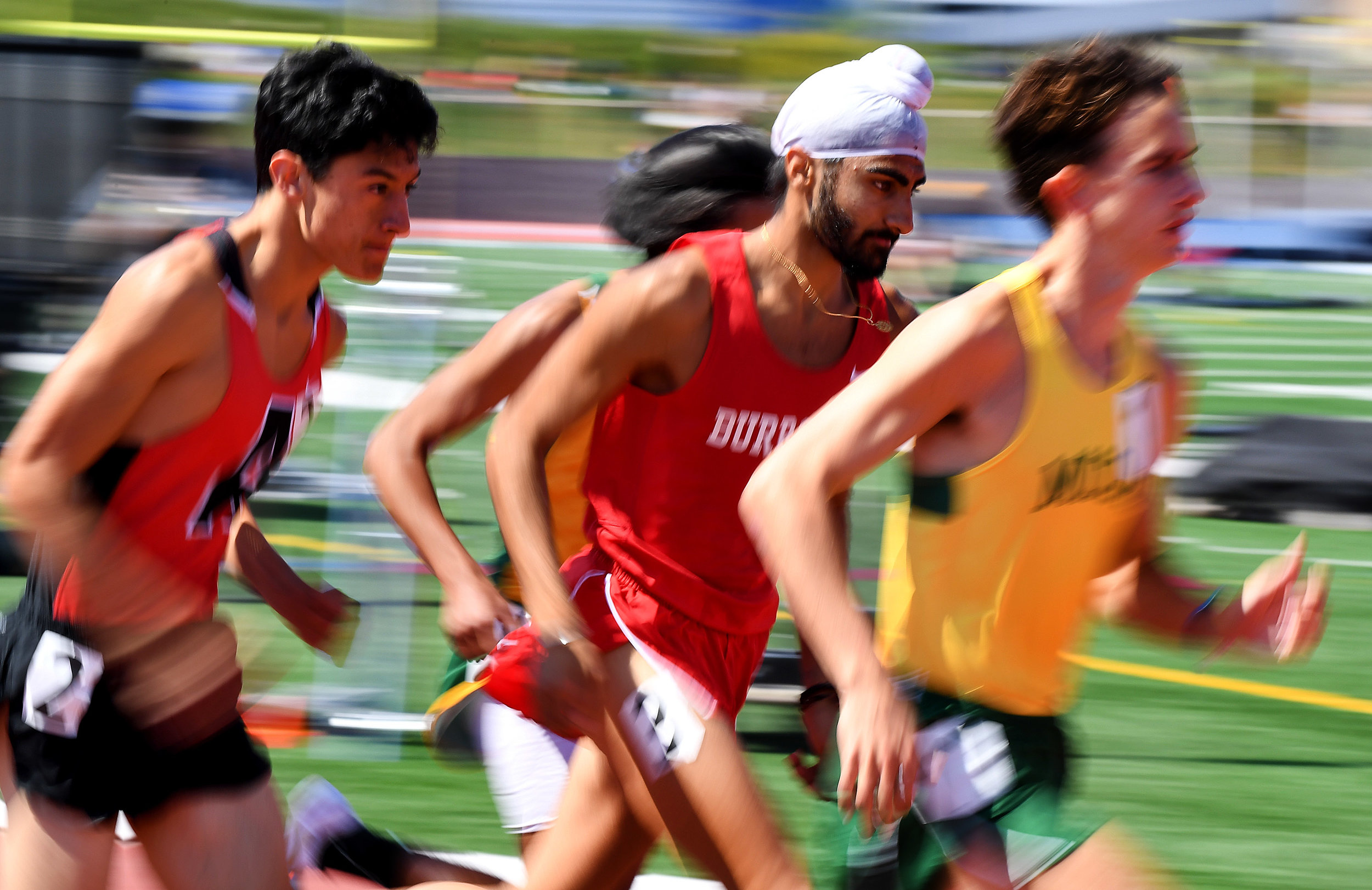  Burroughs' Jagdeep Chahal, center, finished third in the 3200 meter run as Mira Costa's Xavier Court  wins during the CIF-SS Track and Field Masters meet at El Camino College in Torrance, Calif., on Saturday, May 26, 2018.  