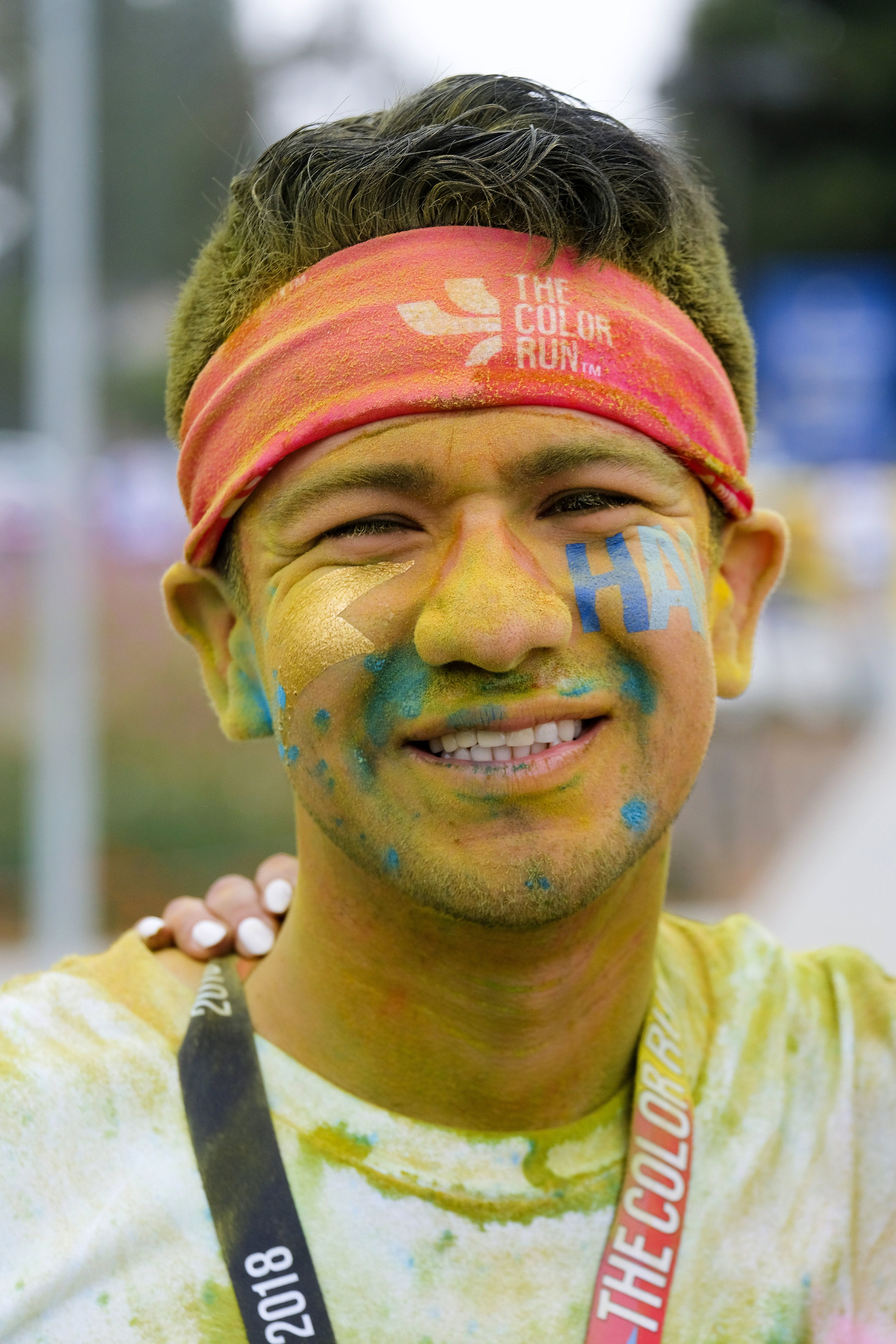  A runner covering with color powder on her face in the Color Run at the StubHub Center in Los Angeles, United States, June 23, 2018. 