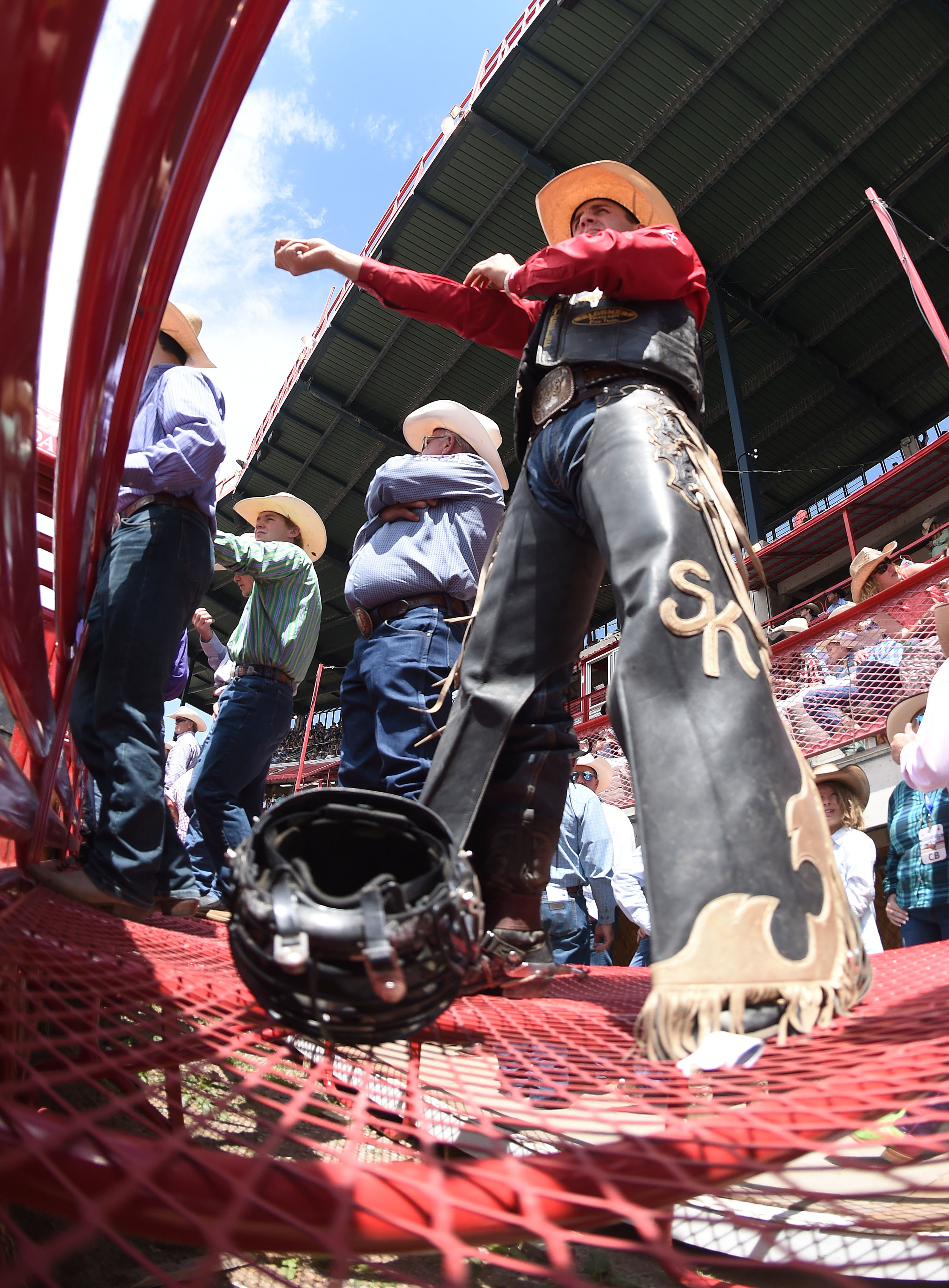  Bull riding champion Sage Kimzey, from Strong City, Oklahoma, prepares for his ride behind the bucking chutes during the 6th performance at the 122nd Cheyenne Frontier Days Rodeo at Frontier Park in Cheyenne, Wyoming Wednesday, July 25, 2018.  