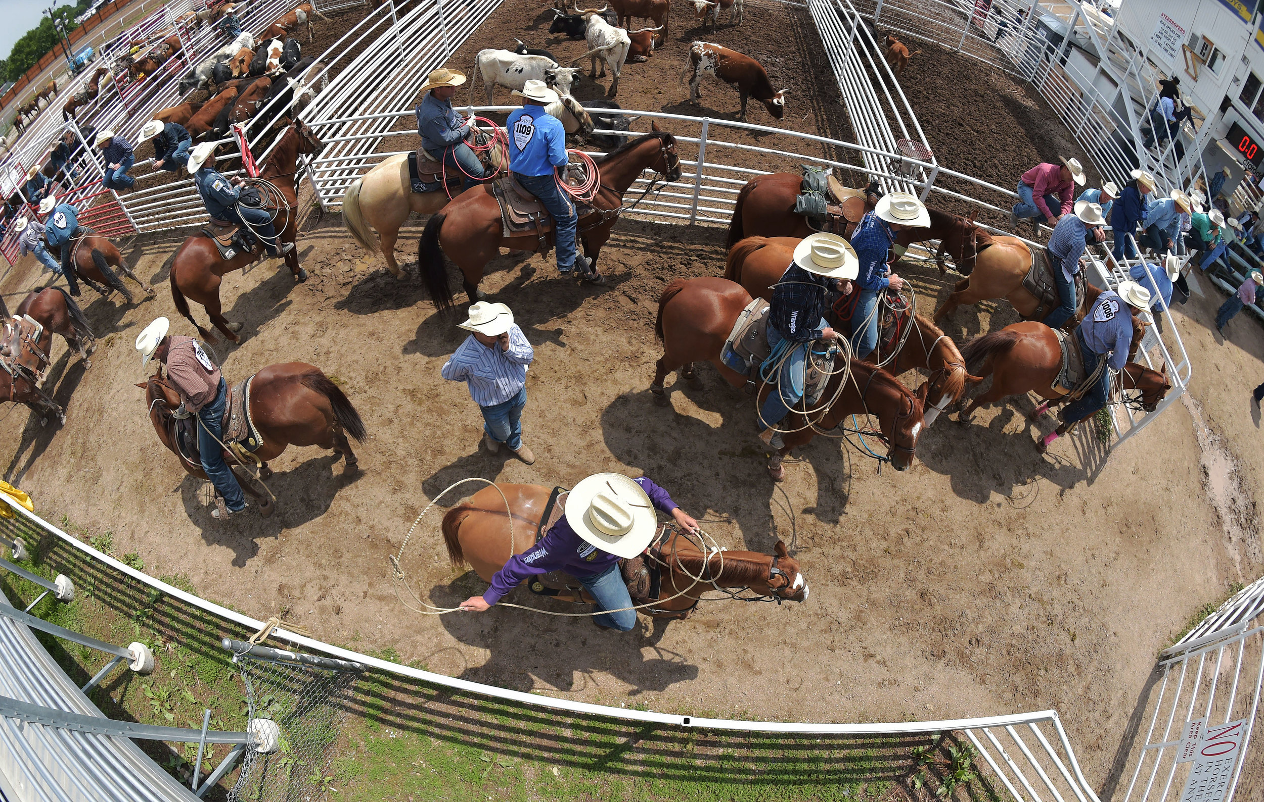  Tie down ropers gather near the chutes prior to their event Saturday July 28, 2018 during the 122nd Cheyenne Frontier Days Rodeo in Cheyenne, Wyoming. 