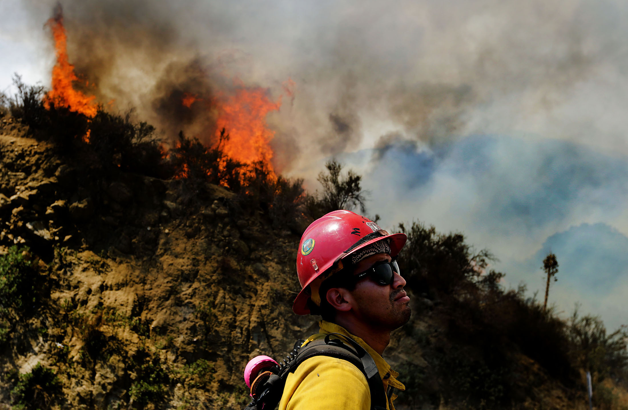  A Hotshot firefighter watches as Cranston fire grows to over 1,200 acres in the San Bernardino National Forest above Hemet on Wednesday, July 25, 2018.  