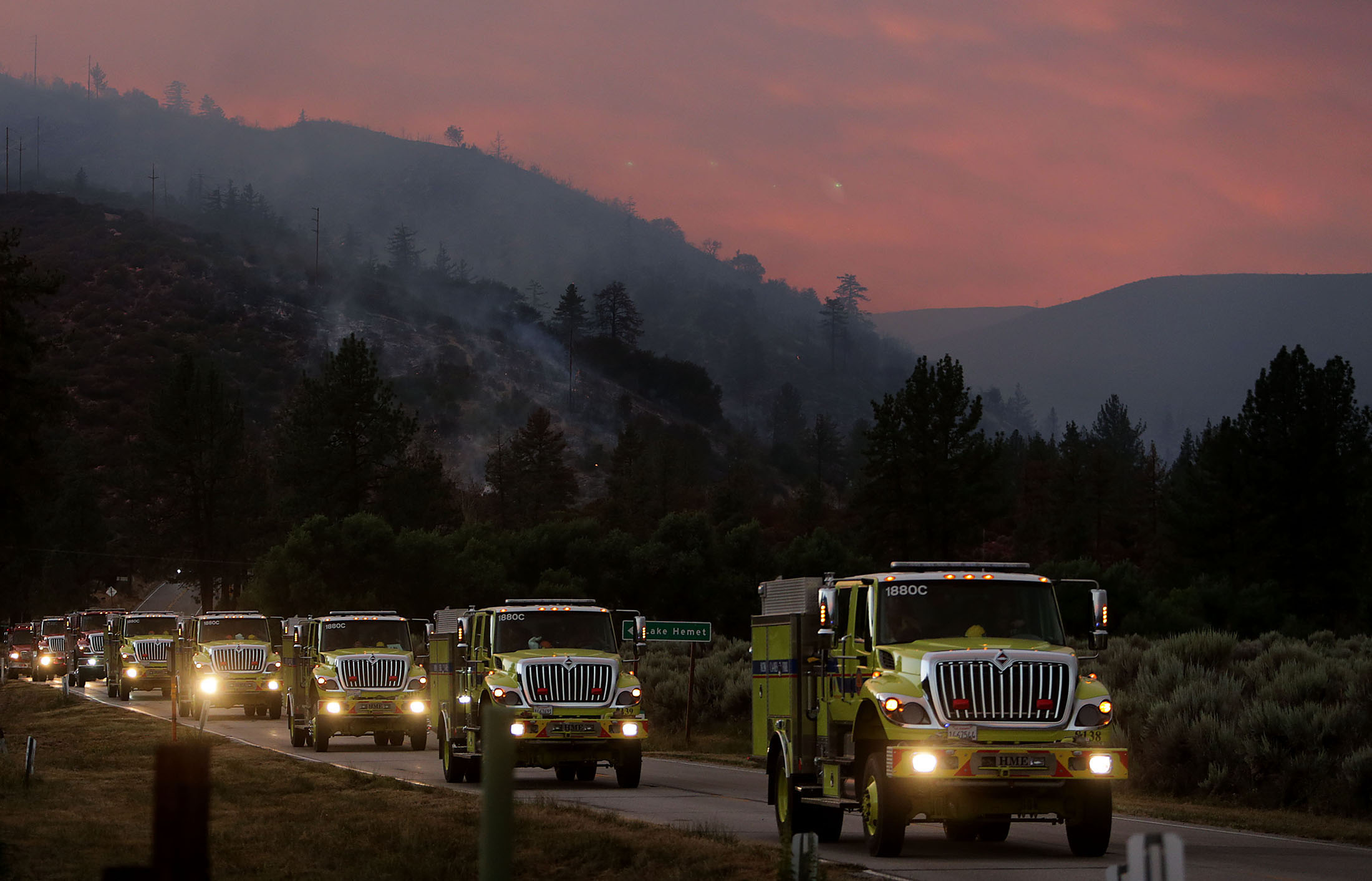  Brush trucks make their way along HWY 74 after battling the Cranston fire in Mountain Center area in the San Bernardino National Forest in Lake Hemet on Thursday, July 26, 2018. 