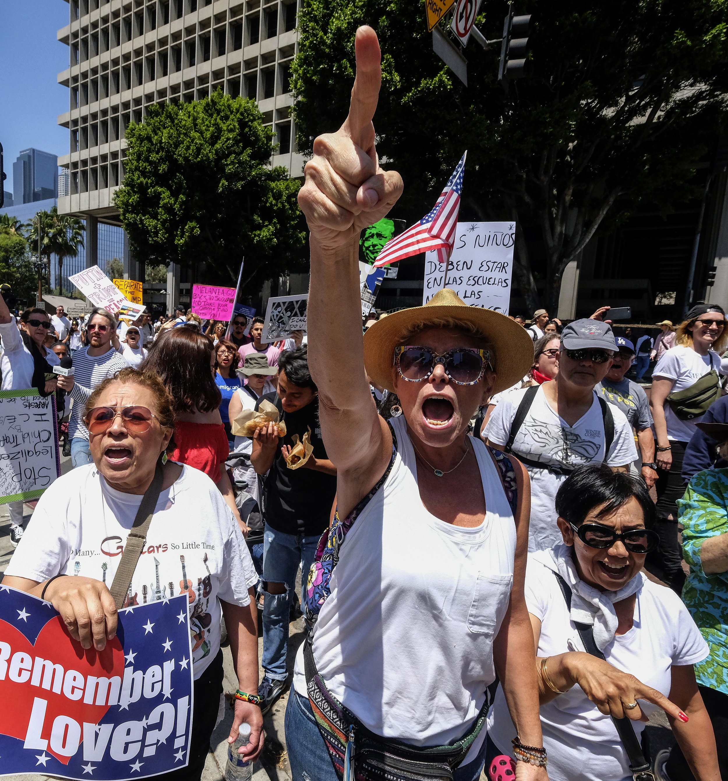  Anti-Trump demonstrators confront Trump supporters during a march against the separation of immigrant families, in Los Angeles on June 30, 2018. It's one of 600-plus marches to be held across the country to demand an end to separating and detaining 