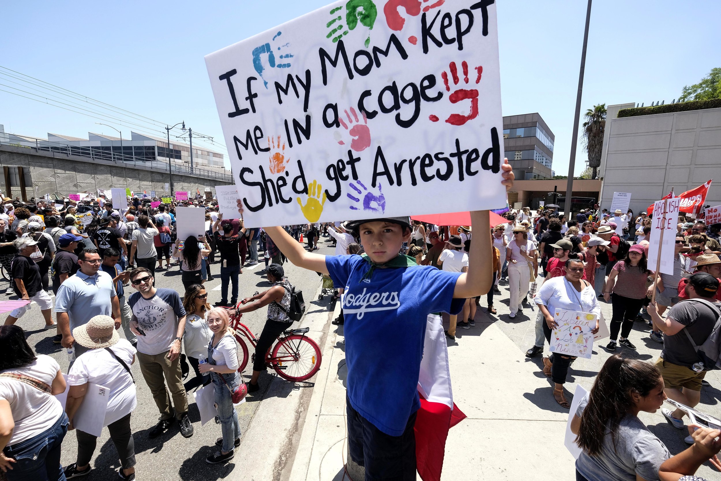  Demonstrators holding signs march against the separation of immigrant families in Los Angeles, the United States, on June 30, 2018. It's one of 600-plus marches to be held across the country to demand an end to separating and detaining families. 