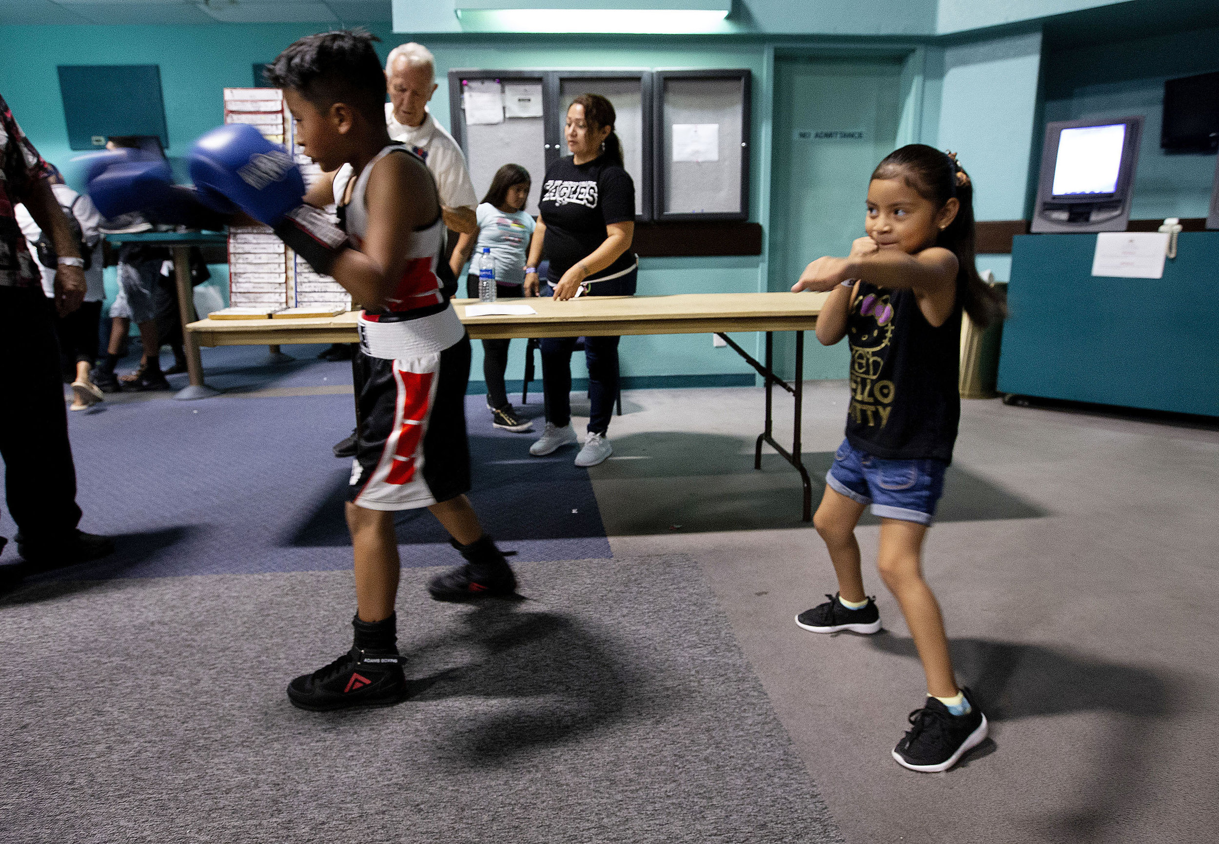 United Boxing Academy boxer Evan Nahuat, 9, left shadow boxes as does his sister Mia Nahuat, 5, both of Moreno Valley minutes before his bout during the Future Olympics Champions at Lake Perris Sports Pavilion in Perris on Saturday, August 18, 2018.