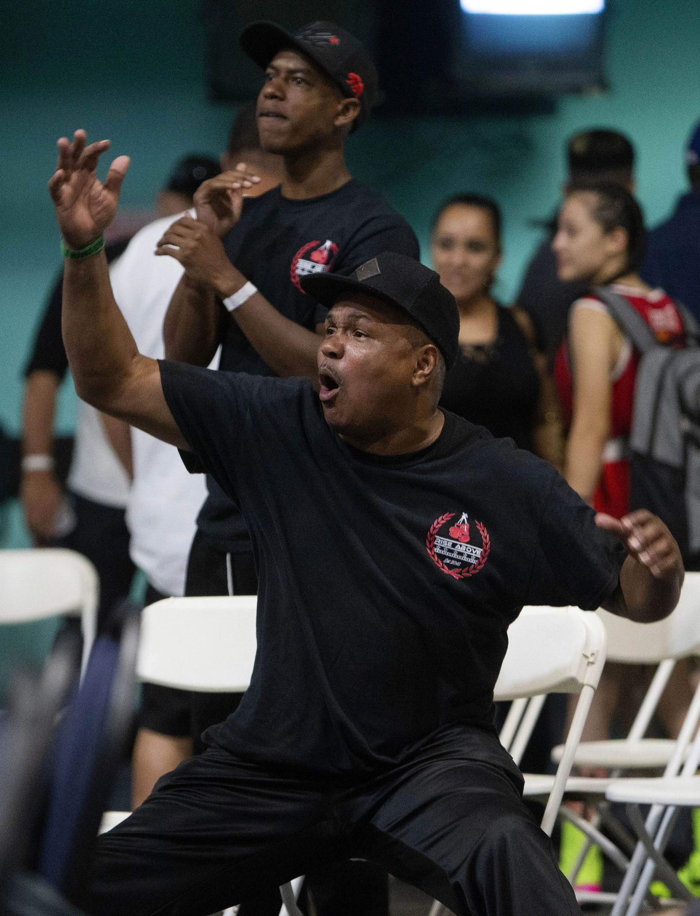 P-Town Boxing trainer Juan West gets excited as boxer Richard Lagunas lands a punch against First United Boxing's Bryant Meza during the Future Olympics Champions at Lake Perris Sports Pavilion in Perris on Saturday, August 18, 2018.