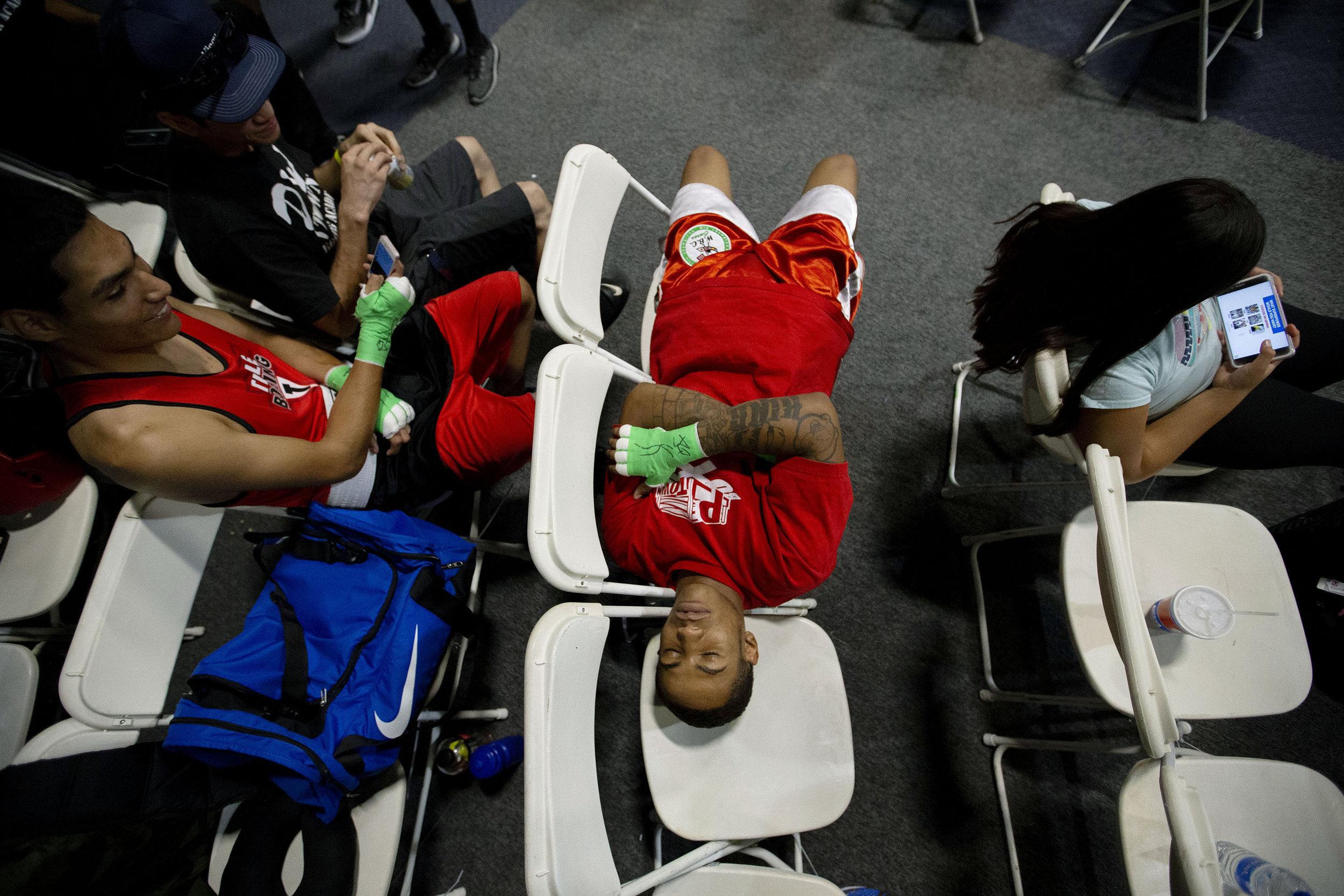  P-Town Boxing's William King finds time nap as he waits for his bout which is the 15th of the day during the Future Olympics Champions at  Lake Perris Sports Pavilion in Perris on Saturday, August 18, 2018.  