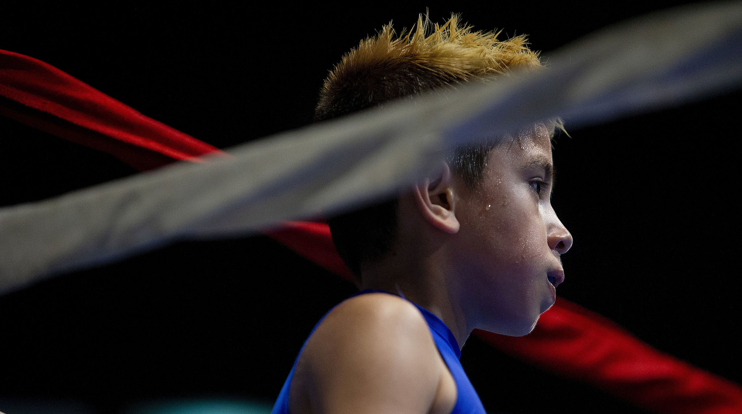  Compton Boxing's Alan Brizuela, 8, waits in the blue corner for the decision after boxing FTP Boxing's Adrian Herrera, 9, during the Future Olympics Champions at  Lake Perris Sports Pavilion in Perris on Saturday, August 18, 2018.  