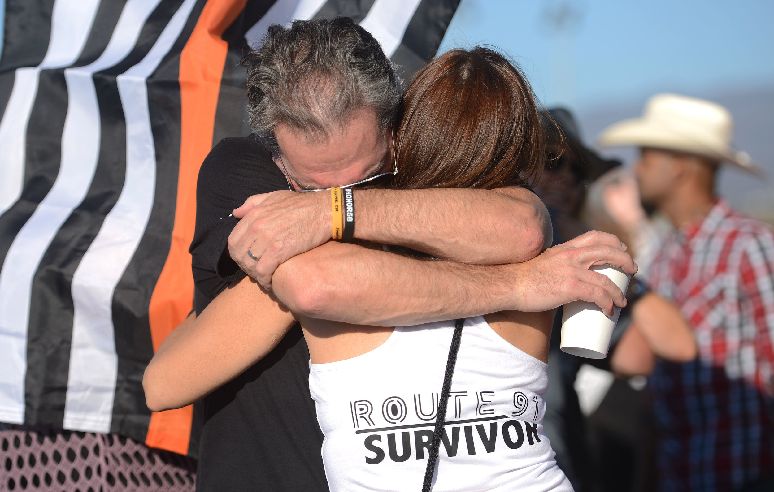  Patrick Murphy, from Burbank, tightly hugs his wife Genae, prior to Jason Aldean's performance Saturday, September 29, 2018 at FivePoint Amphitheatre in Irvine. Genae attended the Route 91 Harvest Festival show with a close friend when they became s