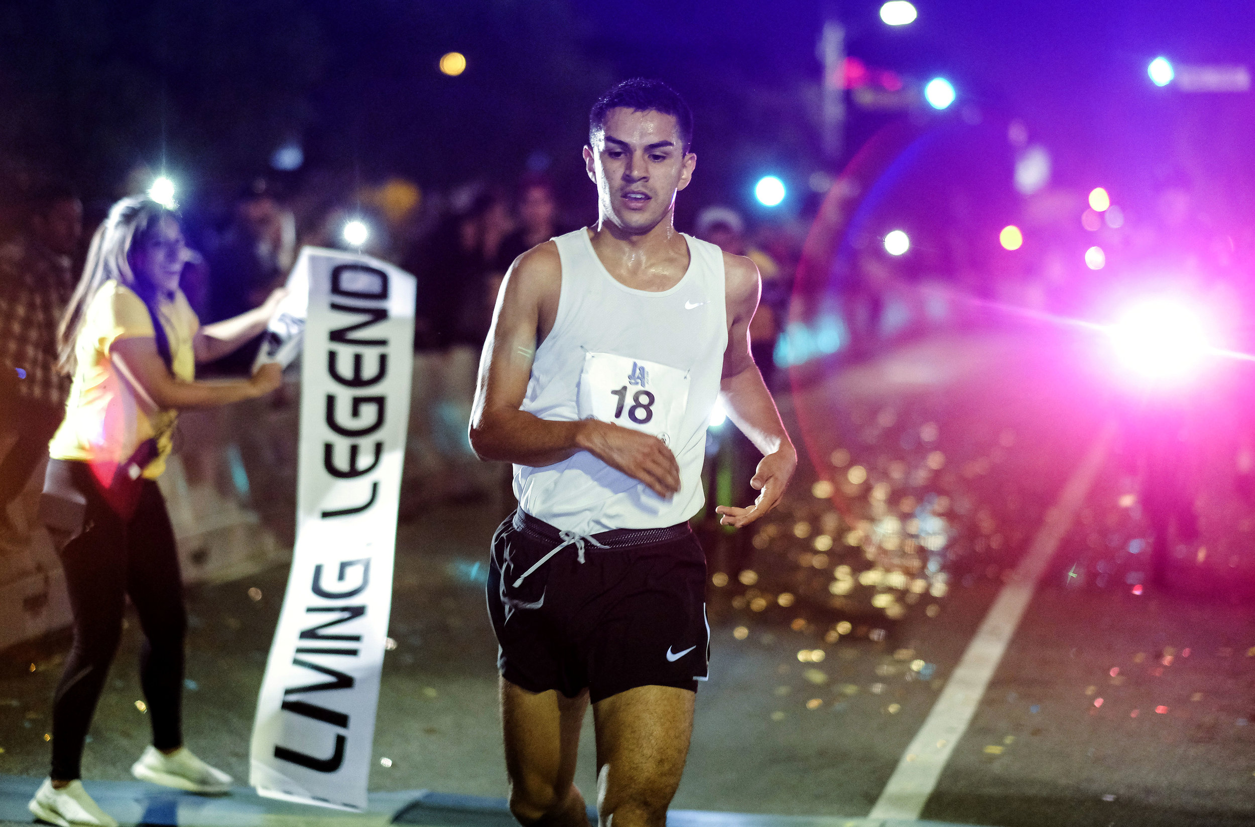  A participant crosses the finish line to win the ``Happy Birthday L.A. 5K 2018'' in downtown Los Angeles, the United States on Sept. 2, 2018. Thousands of runners participated in the event to commemorate the Los Angeles City's 237th birthday. 