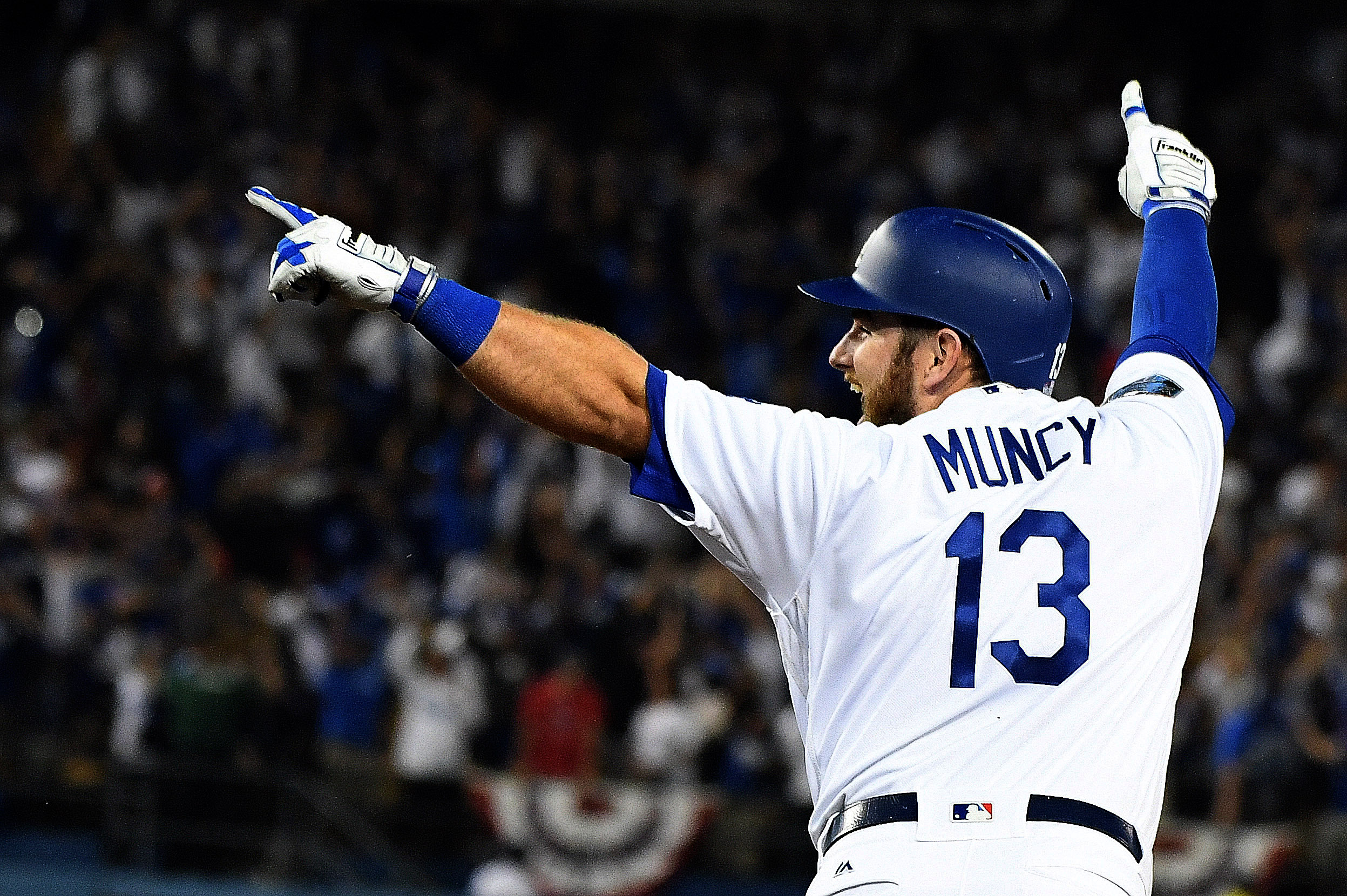  Max Muncy of the Los Angeles Dodgers reacts after hitting the game winning home run to defeat the Boston Red Sox 3-2 in the 18th inning of during game three of the World Series at Dodger Stadium on Friday, October 26, 2018 in Los Angeles, California