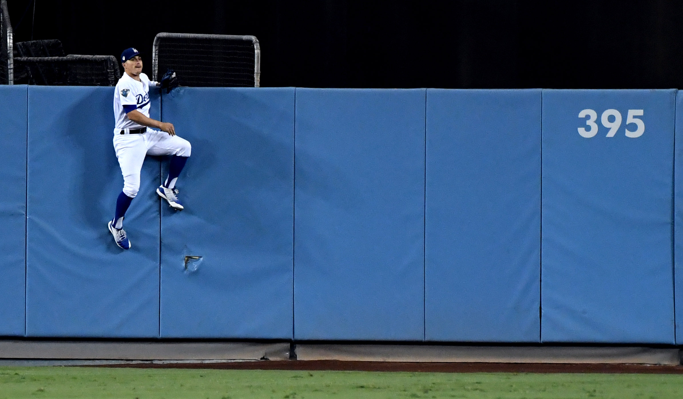  Enrique Hernandez of the Los Angeles Dodgers goes up the wall, but can't reach a Steve Pearce ( not pictured) of the Boston Red Sox solo home run in the eighth inning of game five of the World Series at Dodger Stadium on Sunday, October 28, 2018 in 