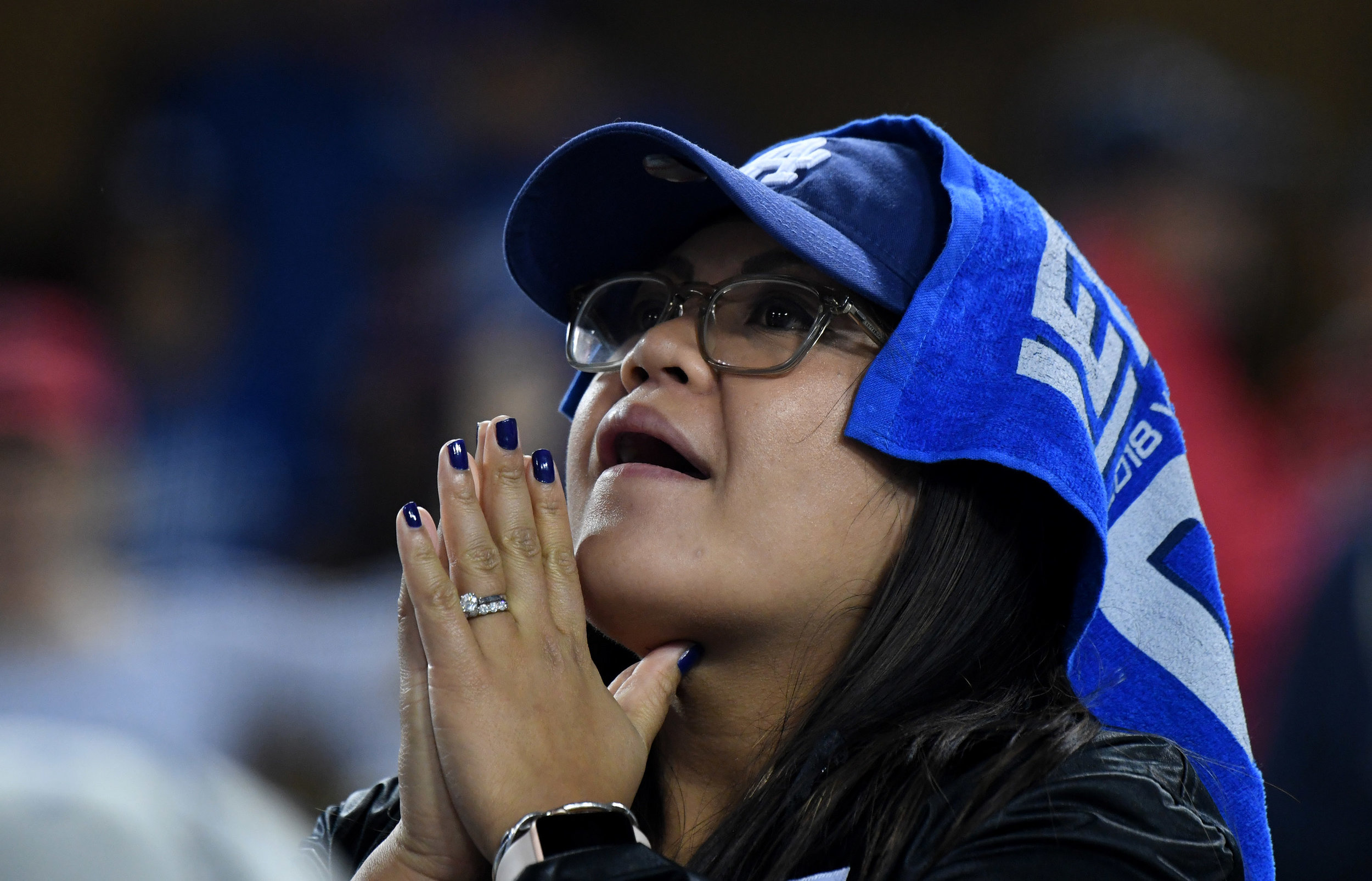  Los Angeles Dodgers fan looks toward the sky in the ninth inning during game five of the World Series against the Boston Red Sox at Dodger Stadium on Sat, October 28, 2018 in Los Angeles, California.  