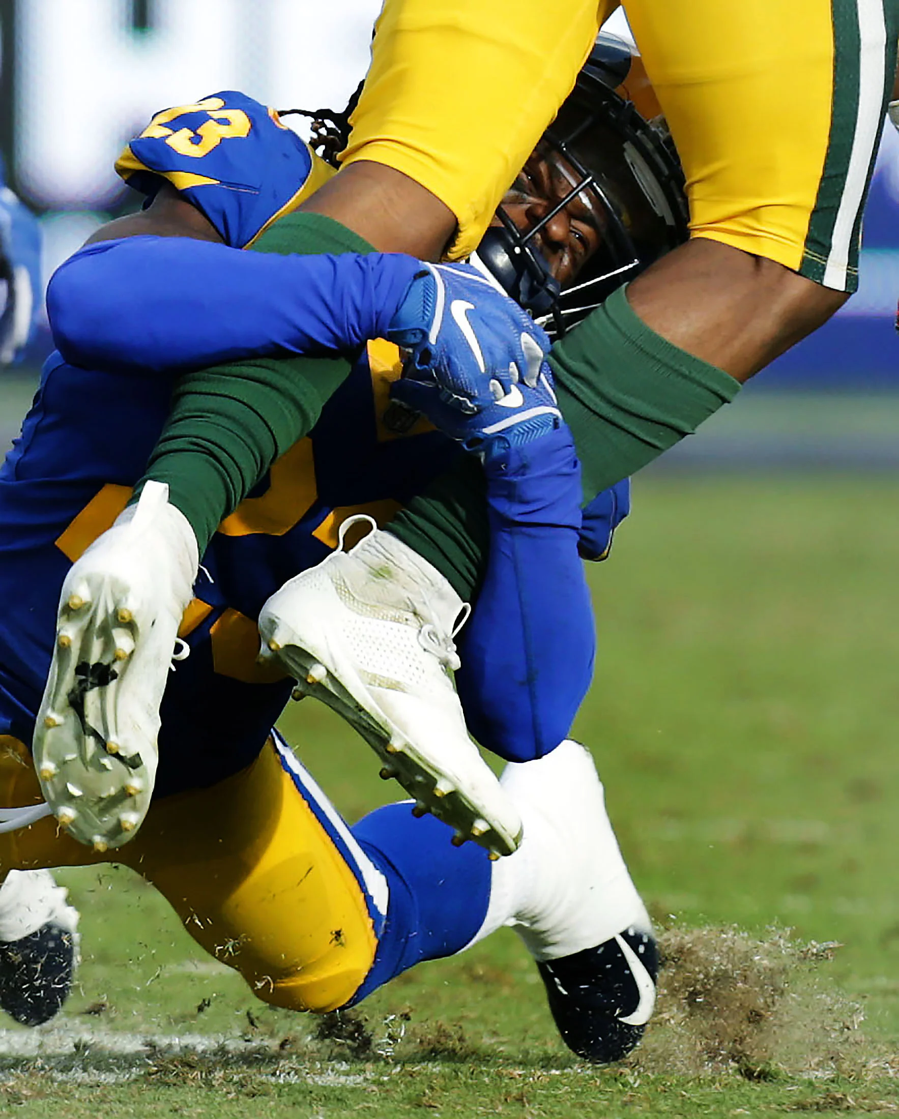 Los Angeles Rams defensive back Nickell Robey-Coleman #23 brings down Green Bay Packers running back Aaron Jones #33 after the catch in the second half of the game at Los Angeles Memorial Coliseum in Los Angeles on Sunday, October 28, 2018.