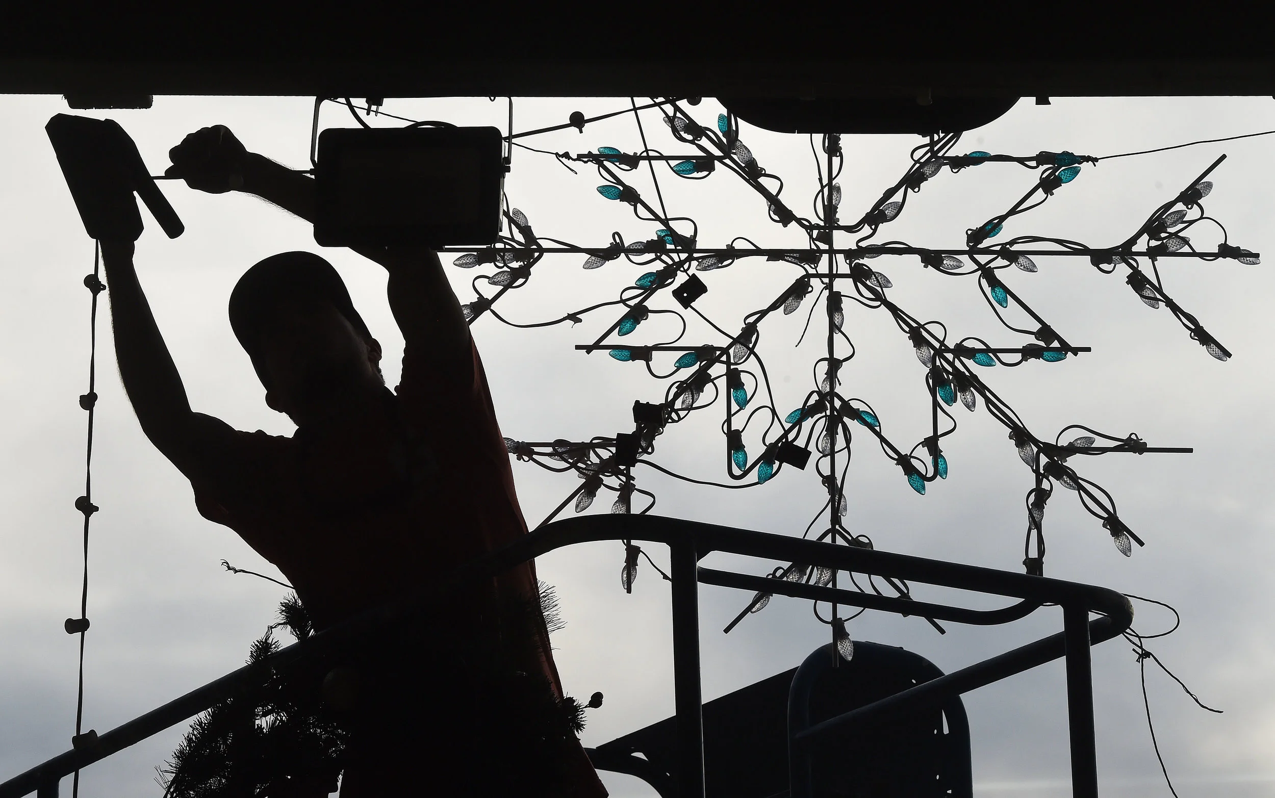  Steve Sanchez puts the finishing touches on the Jolly Holiday Village in the fan zone at Auto Club Speedway in Fontana, Thursday, November 15, 2018. The Jolly Holiday Village is a new addition this season for the Magic of Lights drive through tour a