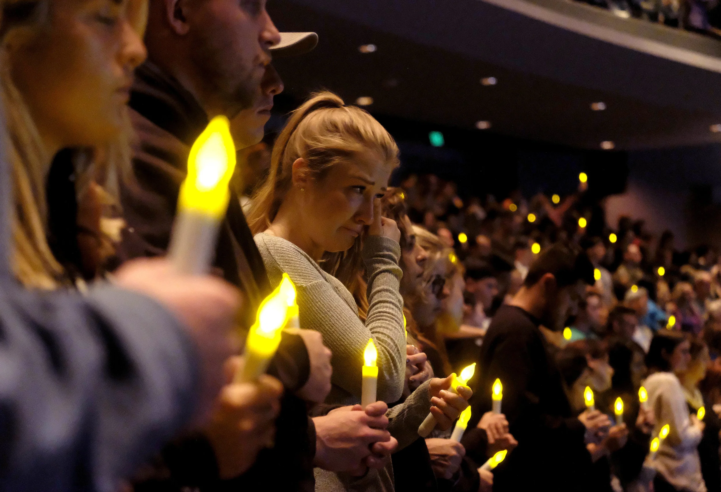  People gather to pray for the victims of the mass shooting during a candlelight vigil in Thousand Oaks , Calif., Thursday, Nov. 8, 2018. A gunman opened fire Wednesday evening inside a country music bar, killing multiple people including a Sheriff o